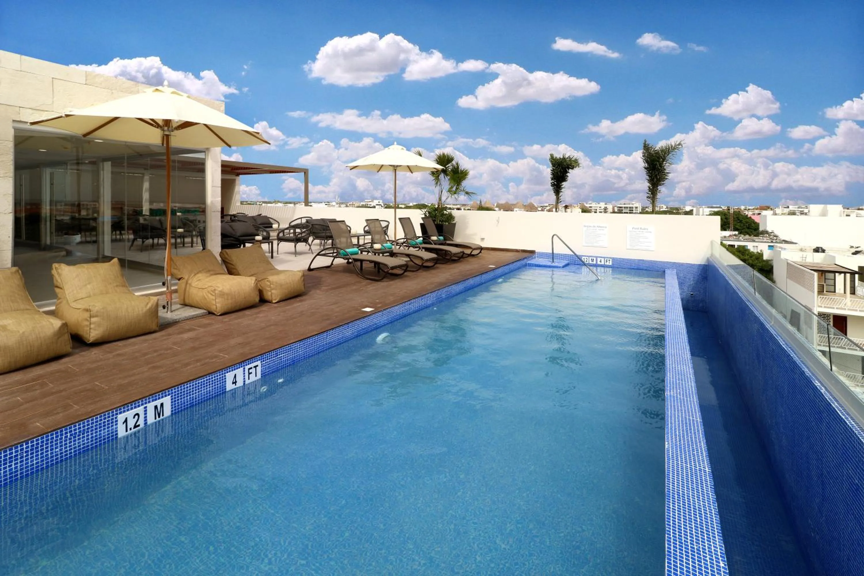 Swimming pool in Holiday Inn Express & Suites - Playa del Carmen by IHG