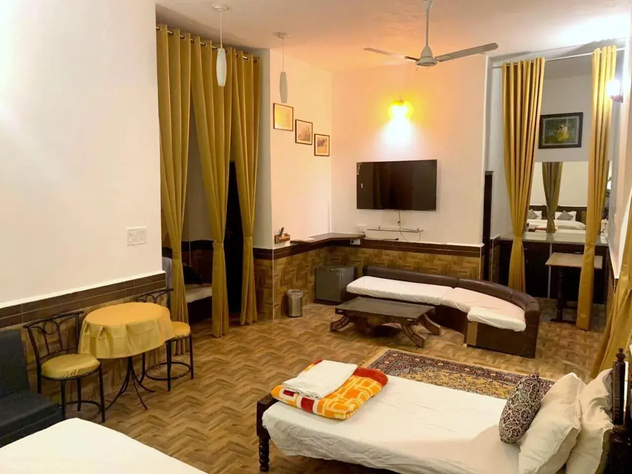 Communal lounge/ TV room, Bed in Haveli Expedition & Resort Communal lounge/ TV room, Bed in Haveli Expedition & Resort