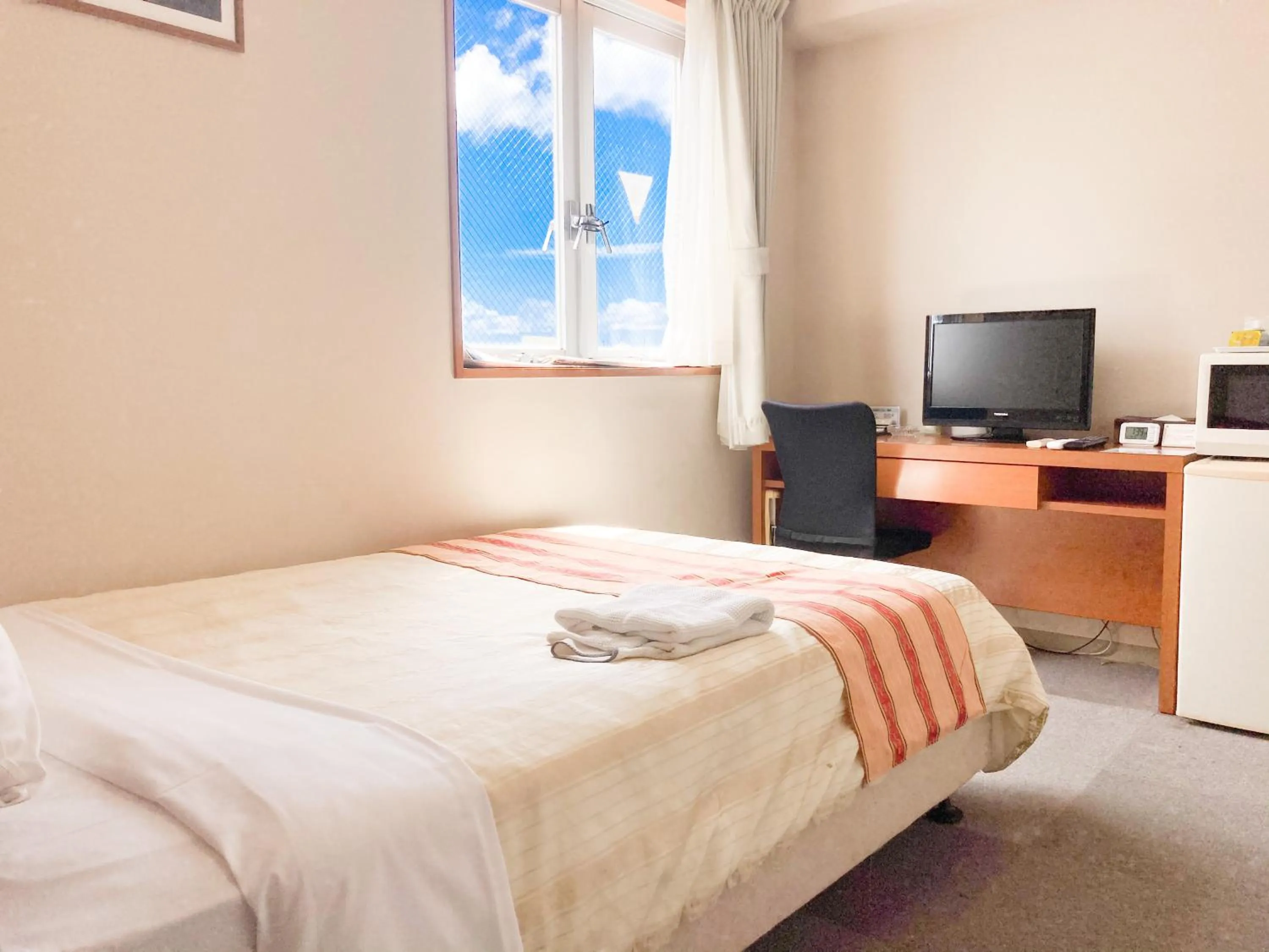 Bed in Hotel Peace Island Miyakojima