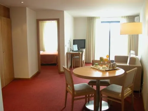 Seating area, Bed in Paredes Hotel Apartamento