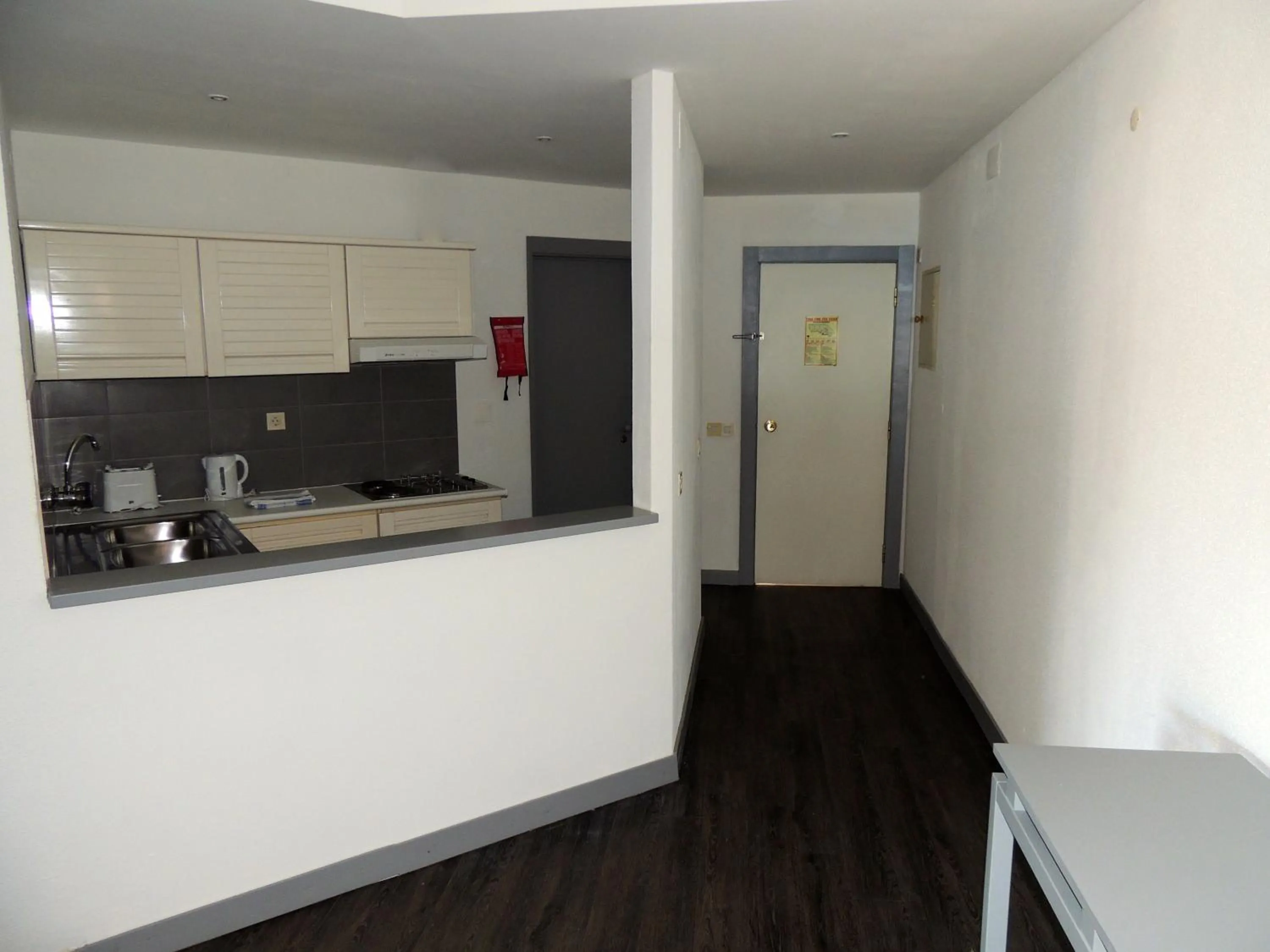 Kitchen or kitchenette in Almar Hotel Apartamento