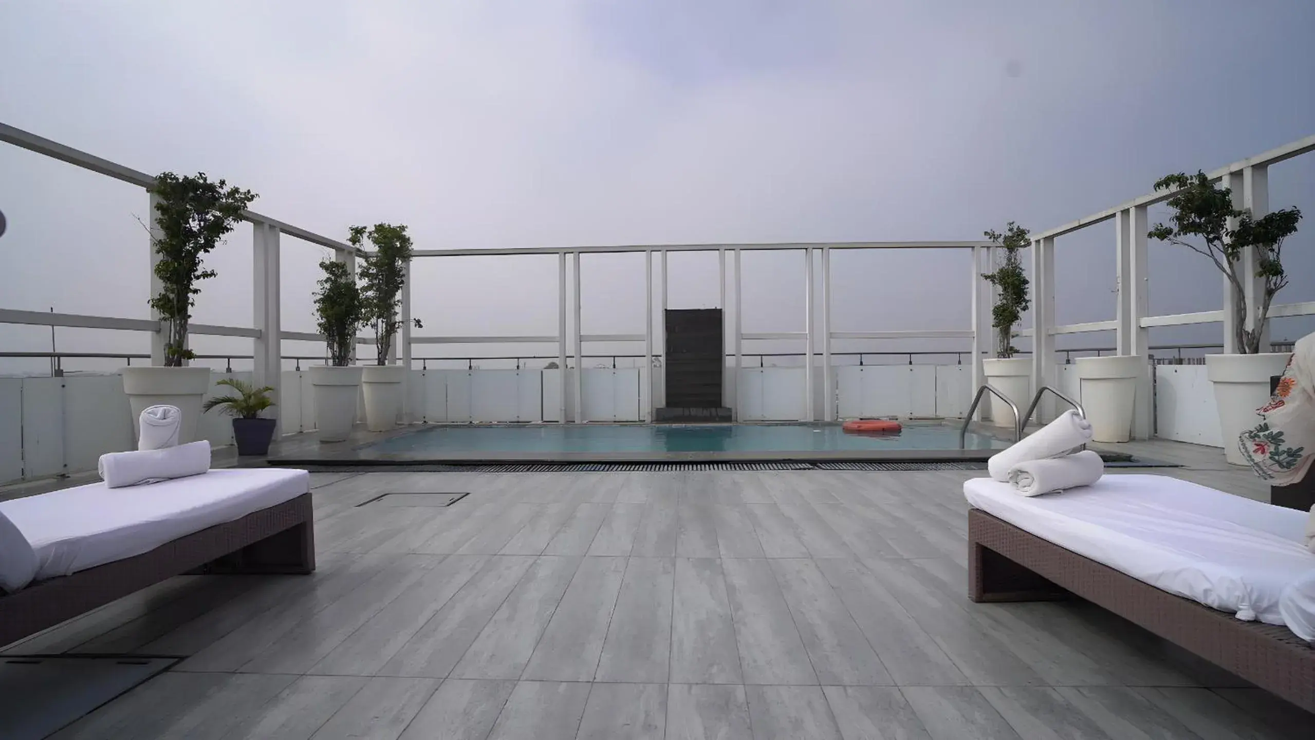 Swimming pool, Bed in Quality Inn Gurgaon Swimming pool, Bed in Quality Inn Gurgaon