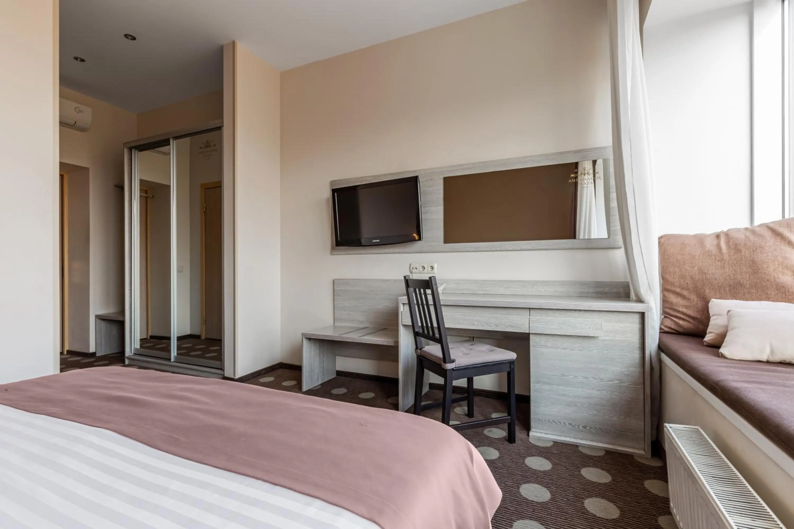 Bed in Ambassador Plaza