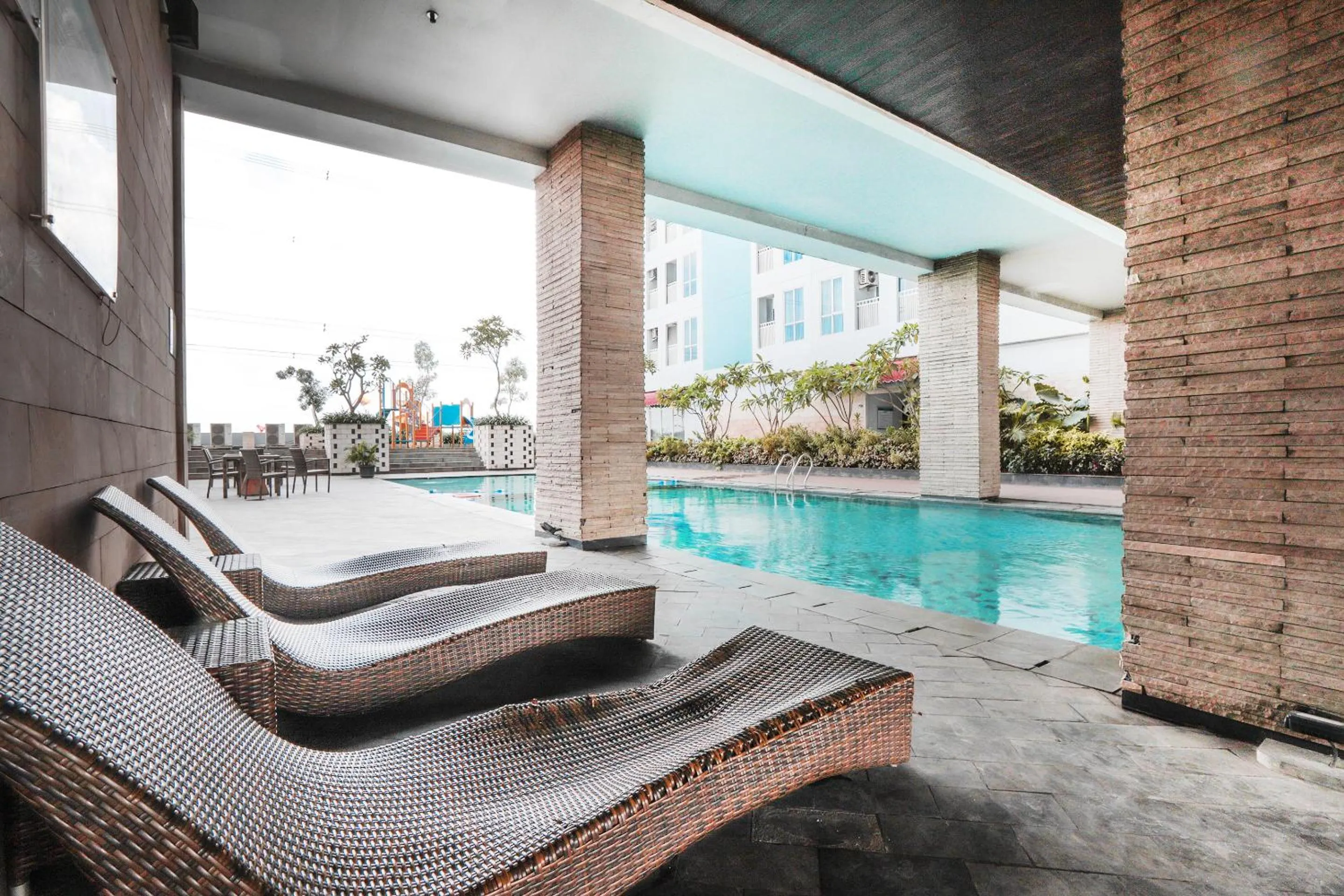 Swimming Pool in OYO  Flagship 755 Appartel Grand Dhika City