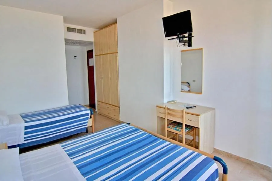 Bed in Hotel Palmarosa