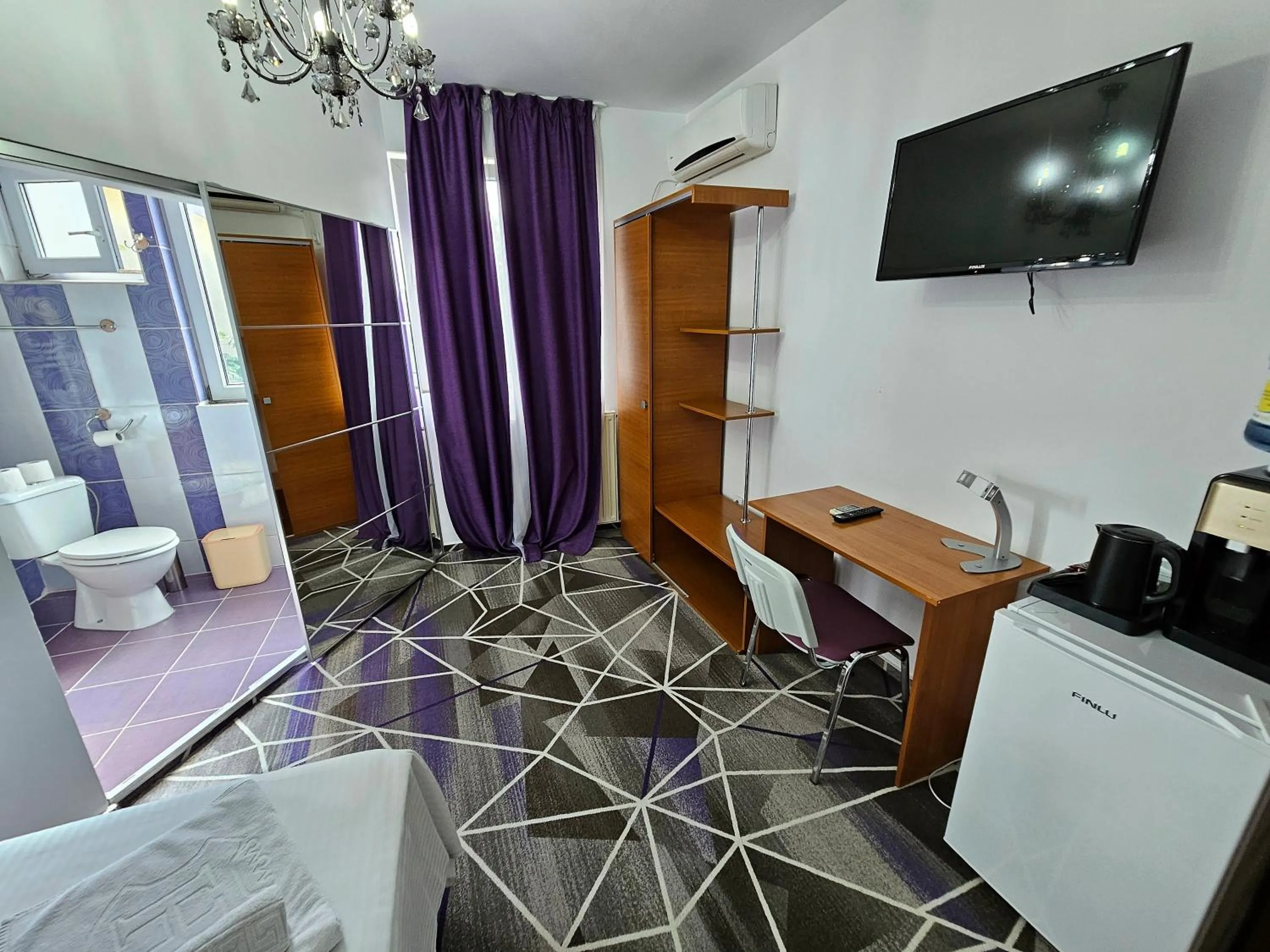 Photo of the whole room in Iris SMART Boutique Self Check-in 24h