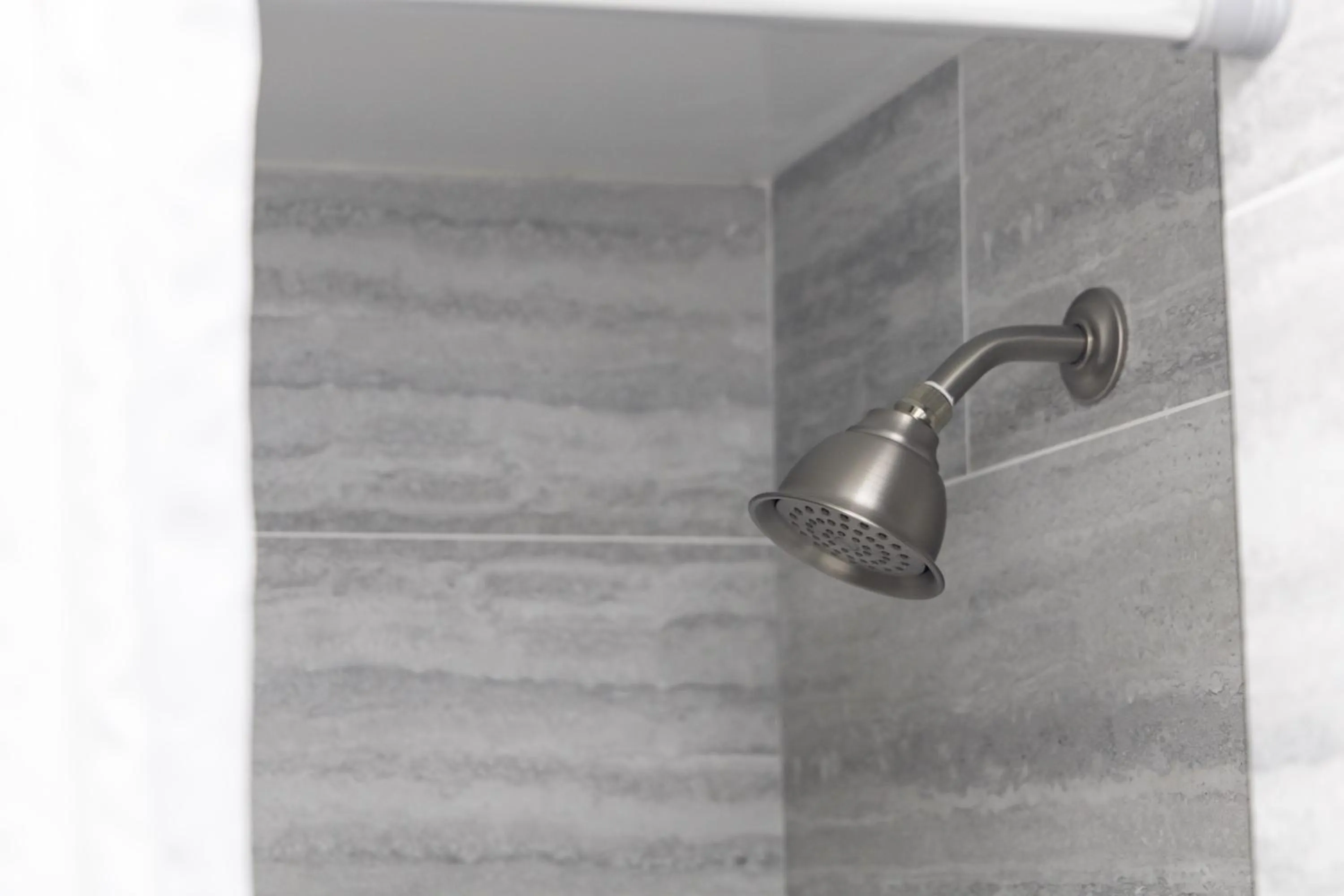 Shower in Renovated Studio with Pool Access at Aloha Surf