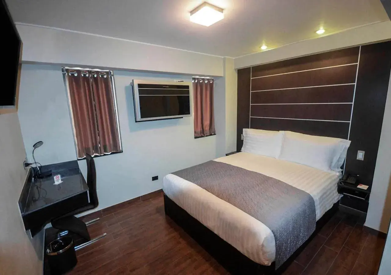 Bedroom, Bed in qp Hotels Trujillo Bedroom, Bed in qp Hotels Trujillo