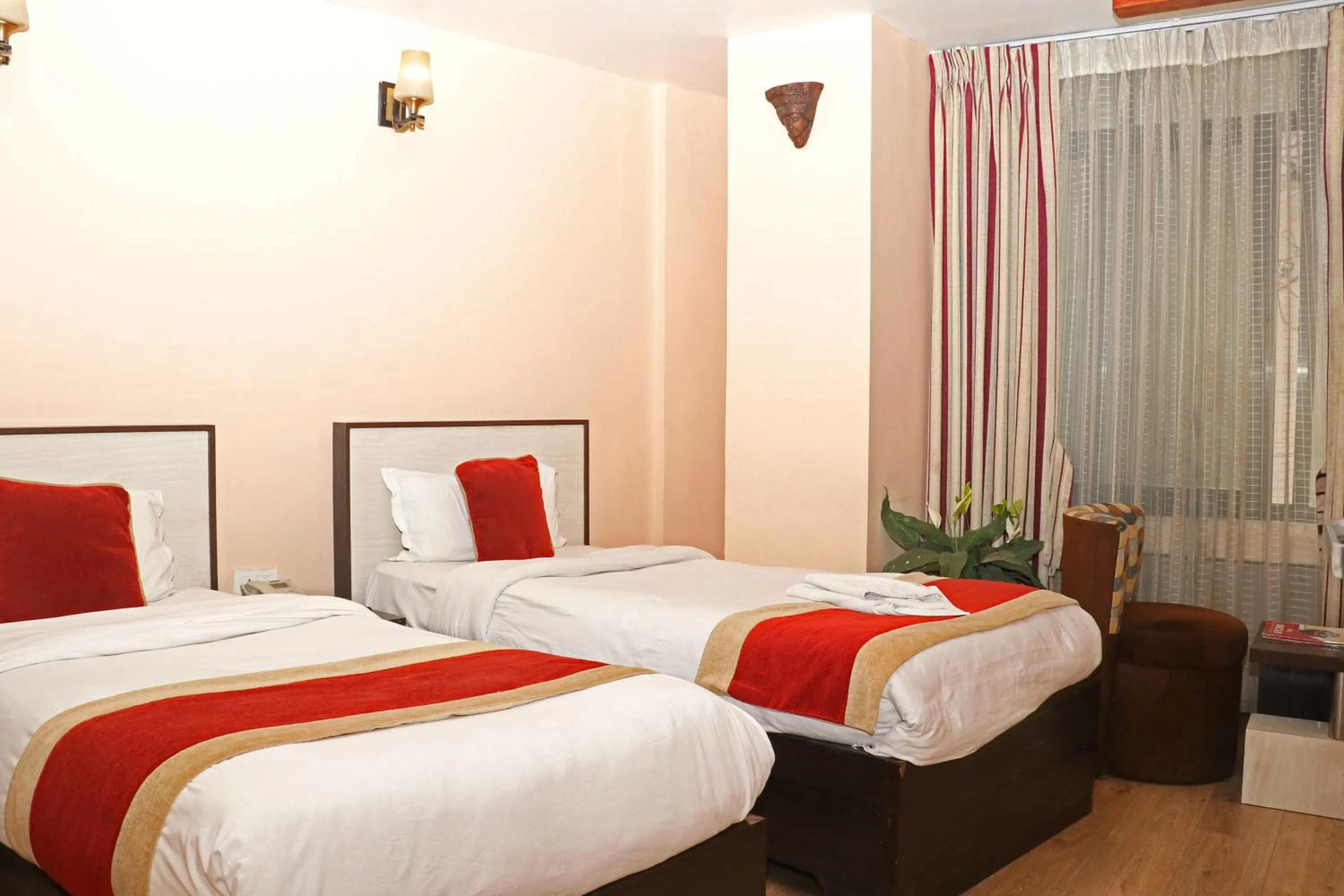 Bed in Hotel Readers Inn Pvt.Ltd