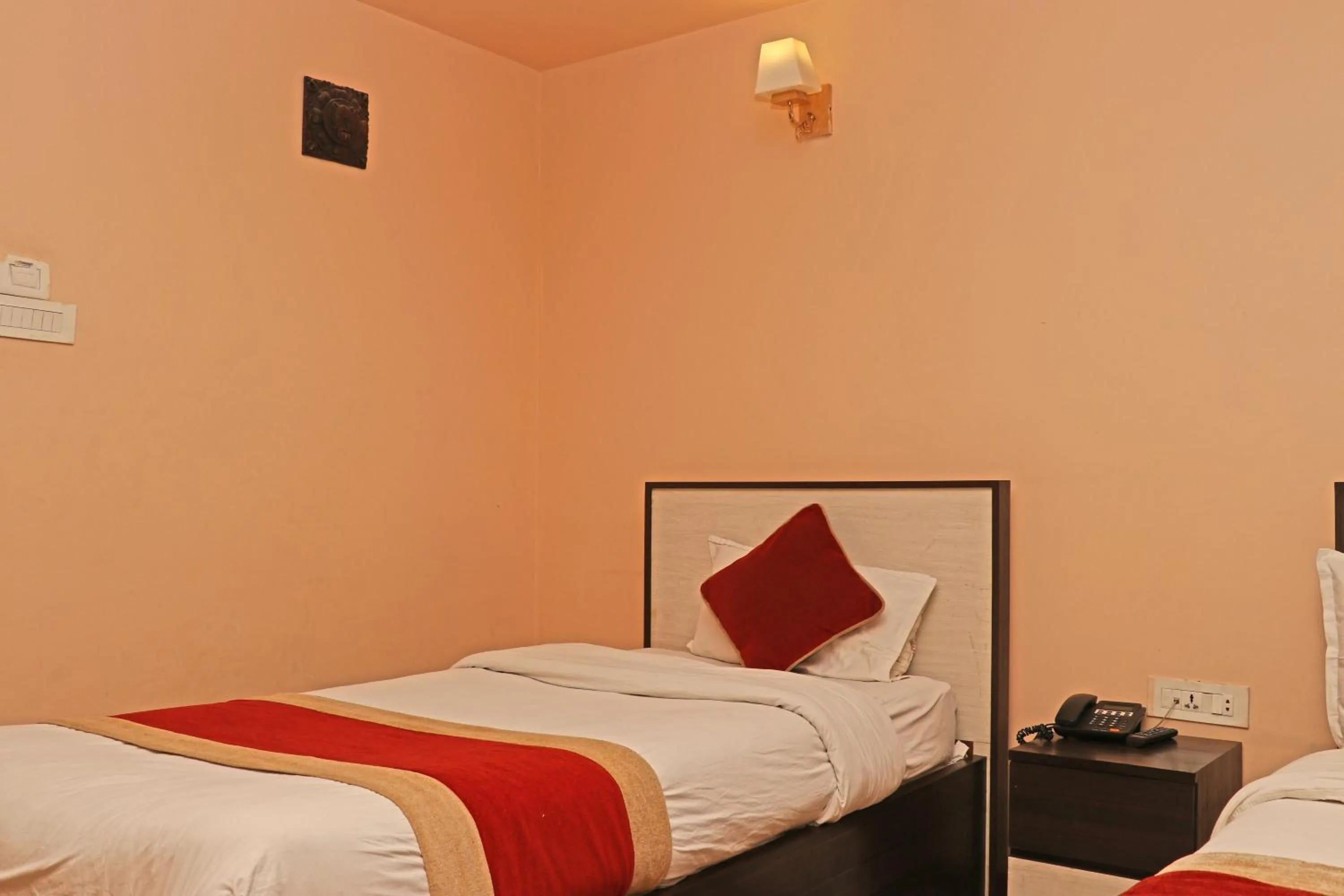 Bed in Hotel Readers Inn Pvt.Ltd