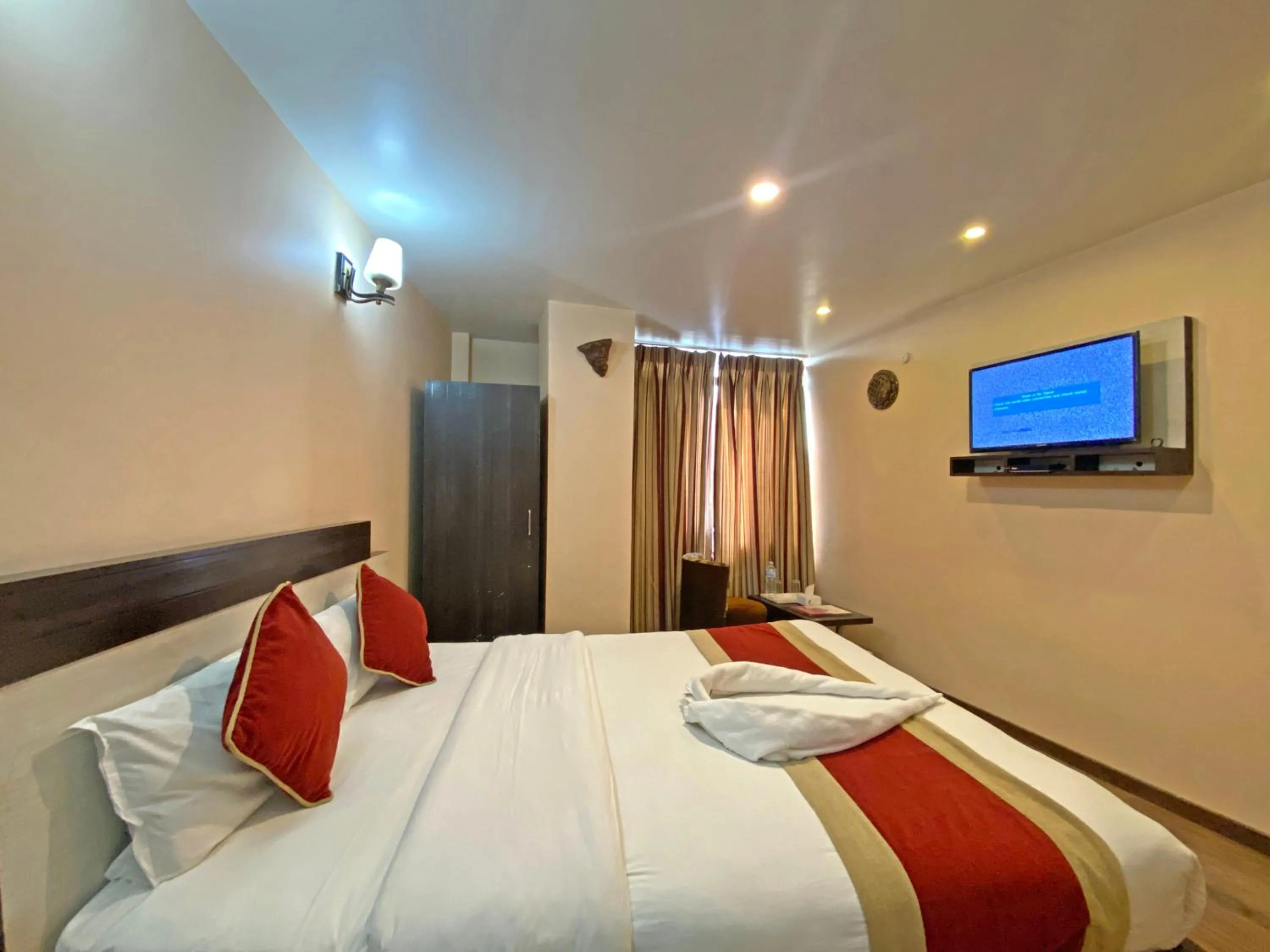 Bedroom in Hotel Readers Inn Pvt.Ltd