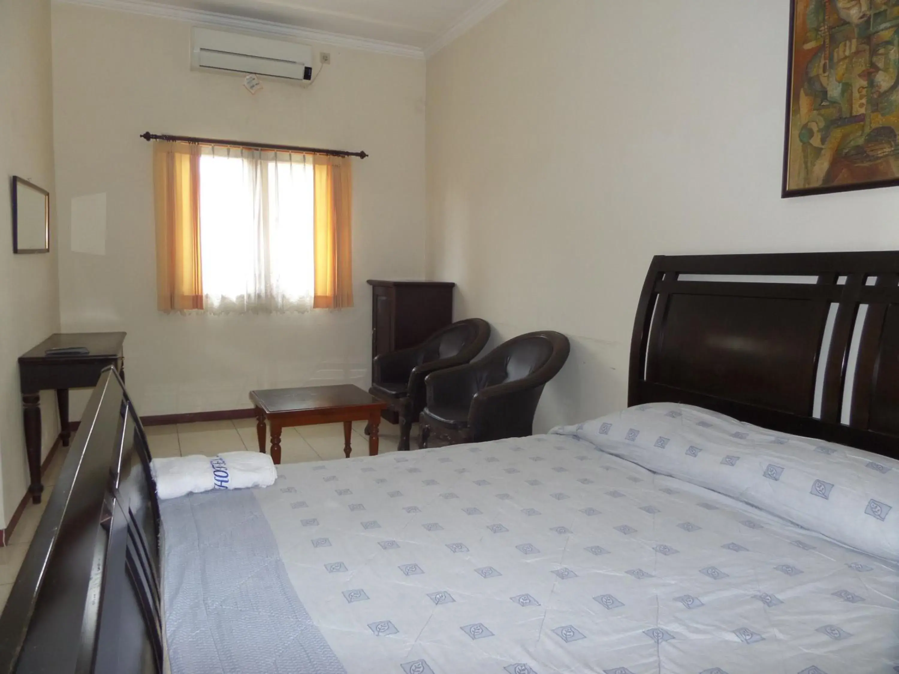 Seating area, Bed in Armi Hotel Malang Seating area, Bed in Armi Hotel Malang