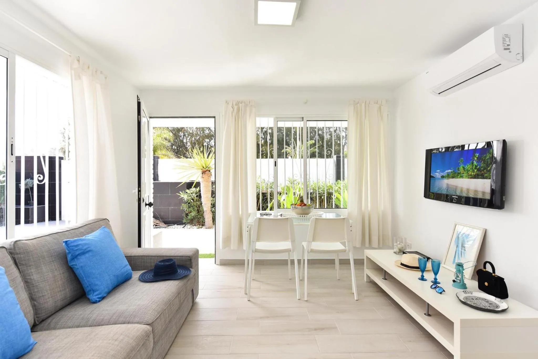 TV and multimedia in Beach House with private pool in San Agustín ET2 by VillaGranCanaria