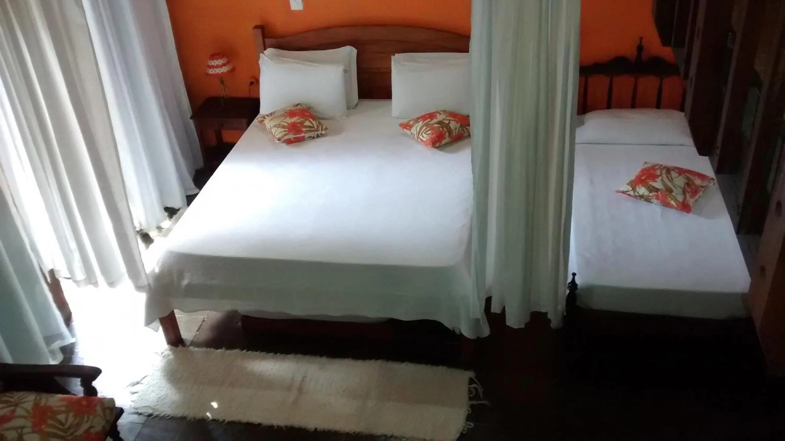 Photo of the whole room in Pousada Arte Colonial - Casarão Histórico do Séc XVIII - Lancha Própria