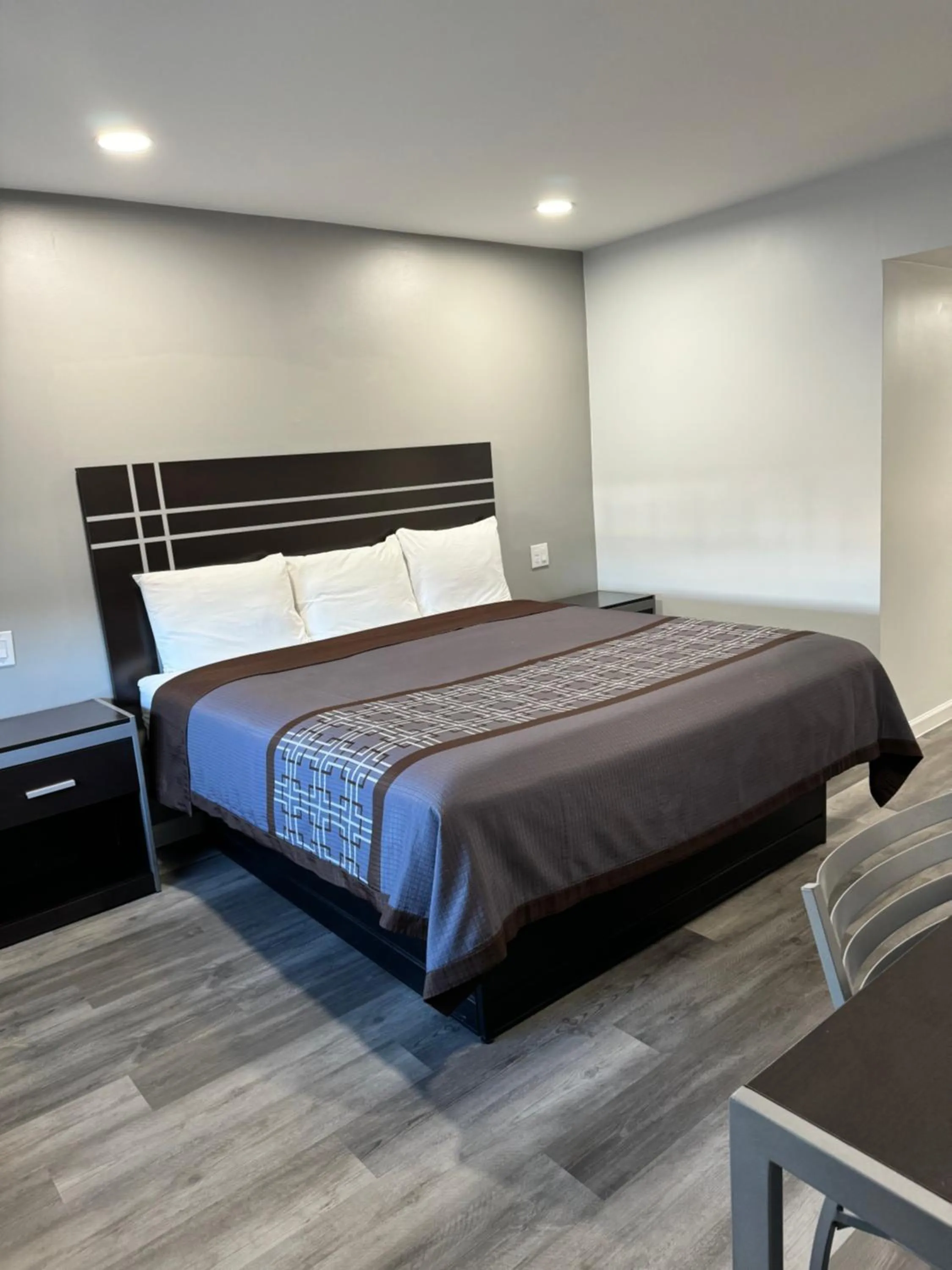 Bed in Continental Inn and Suites Nacogdoches TX SFA University Downtown