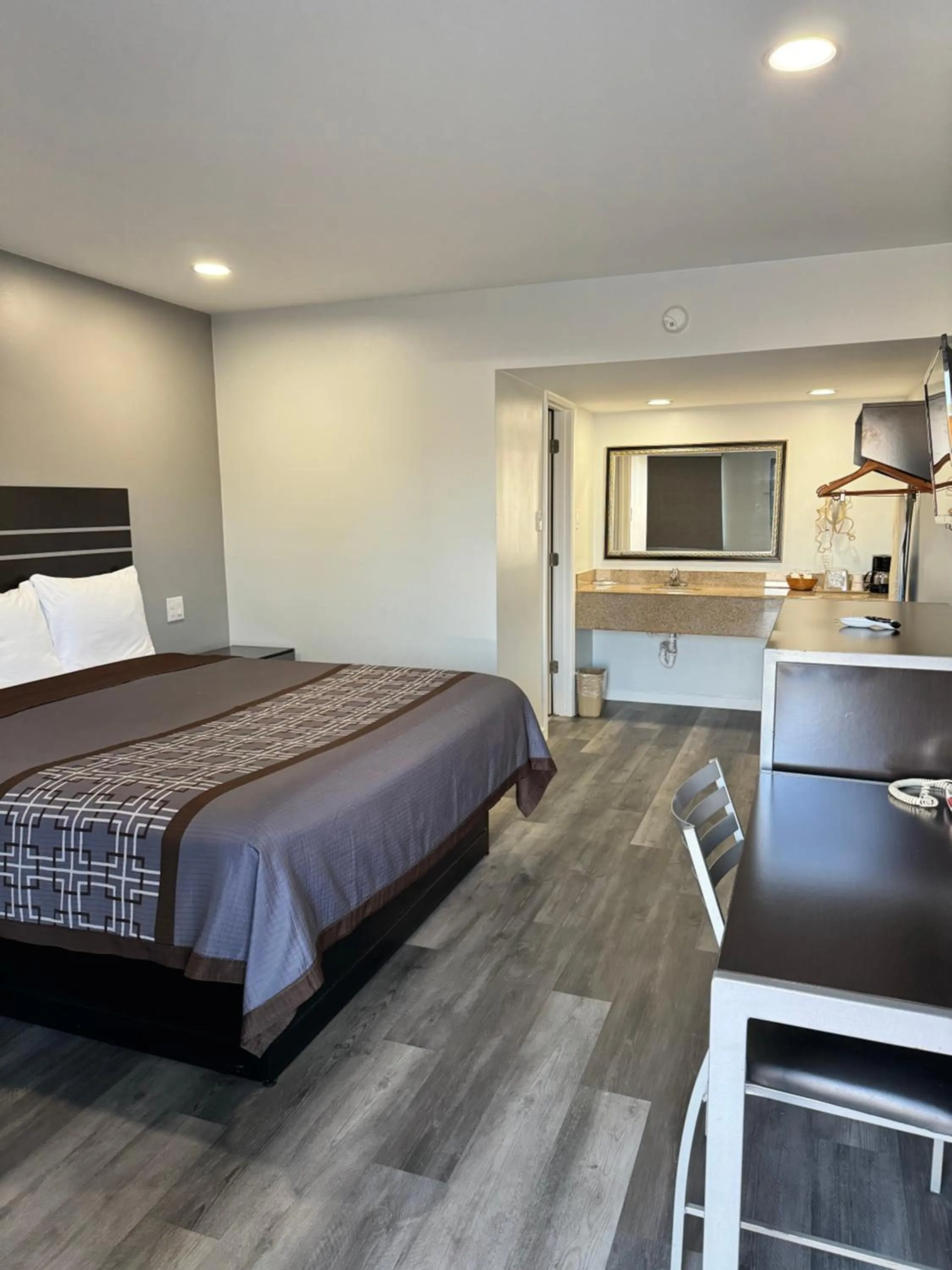 Bed in Continental Inn and Suites Nacogdoches TX SFA University Downtown