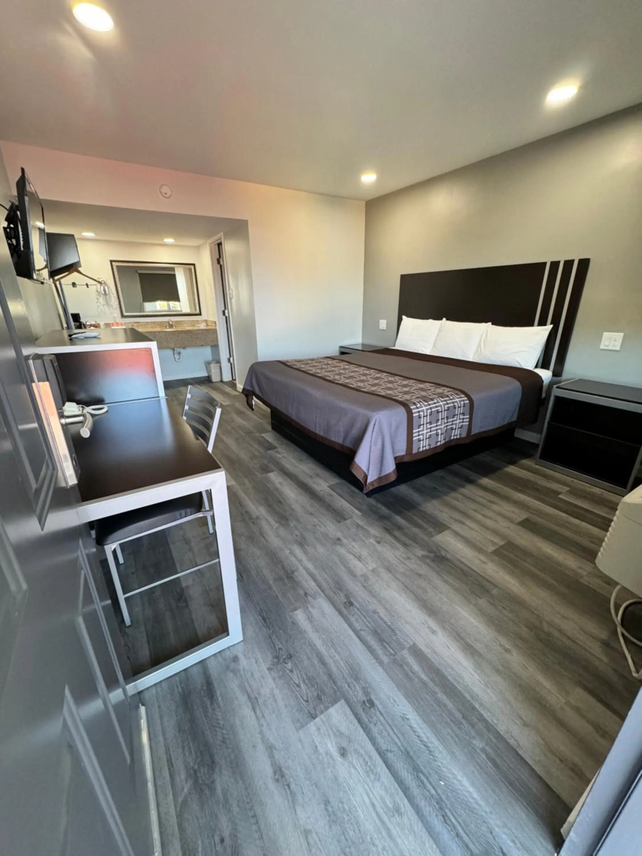 Bed in Continental Inn and Suites Nacogdoches TX SFA University Downtown