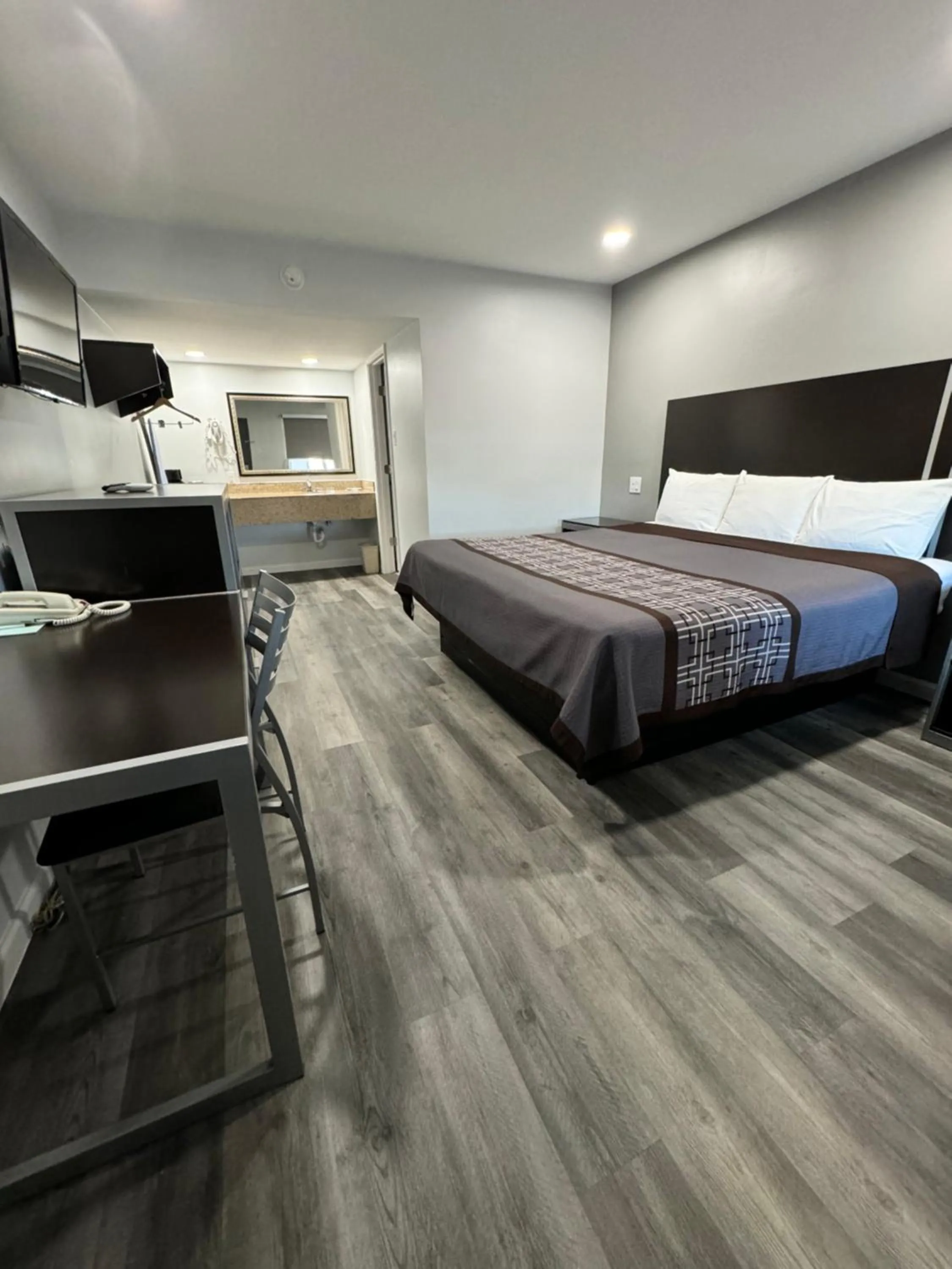 Bed in Continental Inn and Suites Nacogdoches TX SFA University Downtown