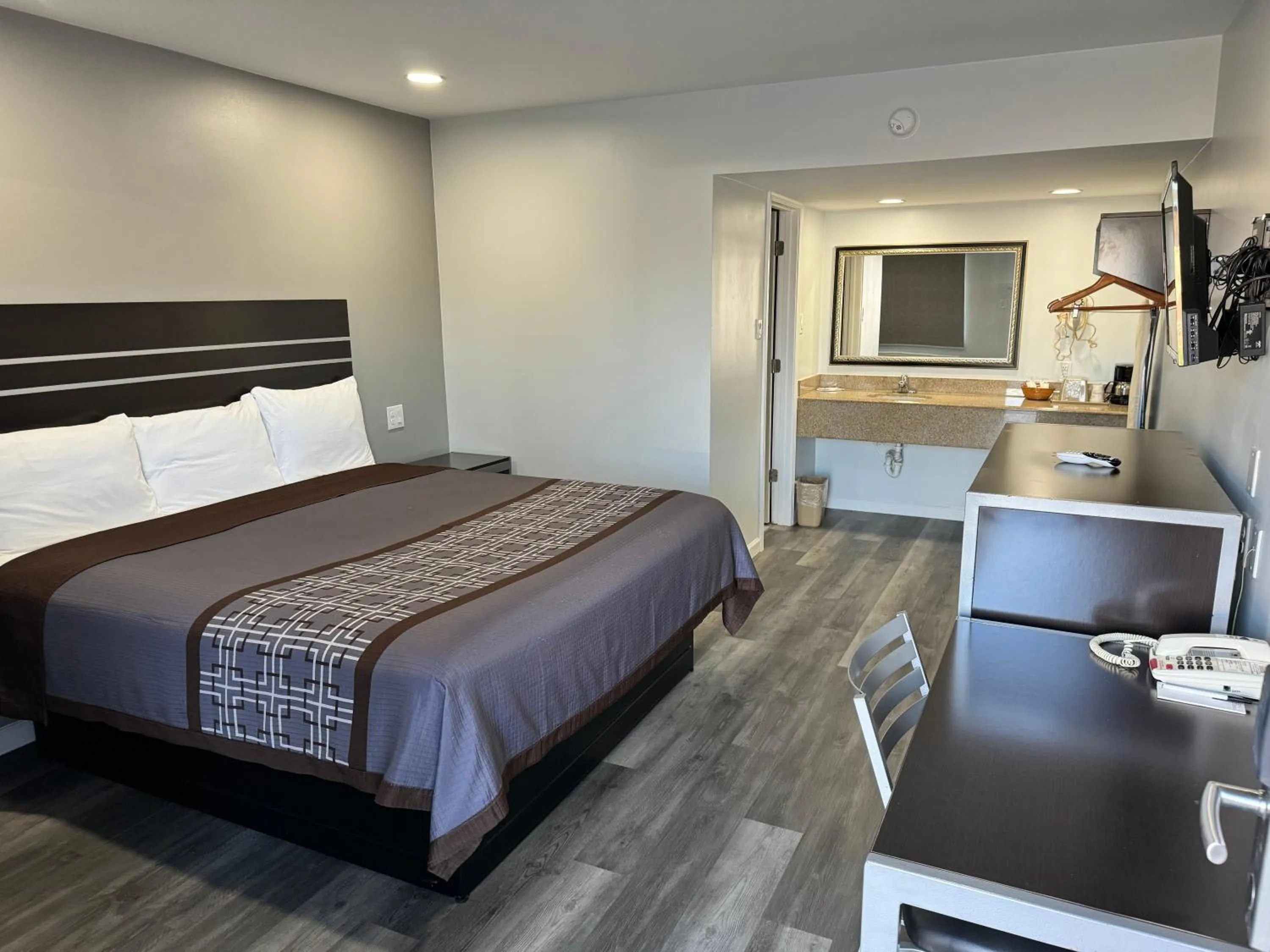 Bed in Continental Inn and Suites Nacogdoches TX SFA University Downtown