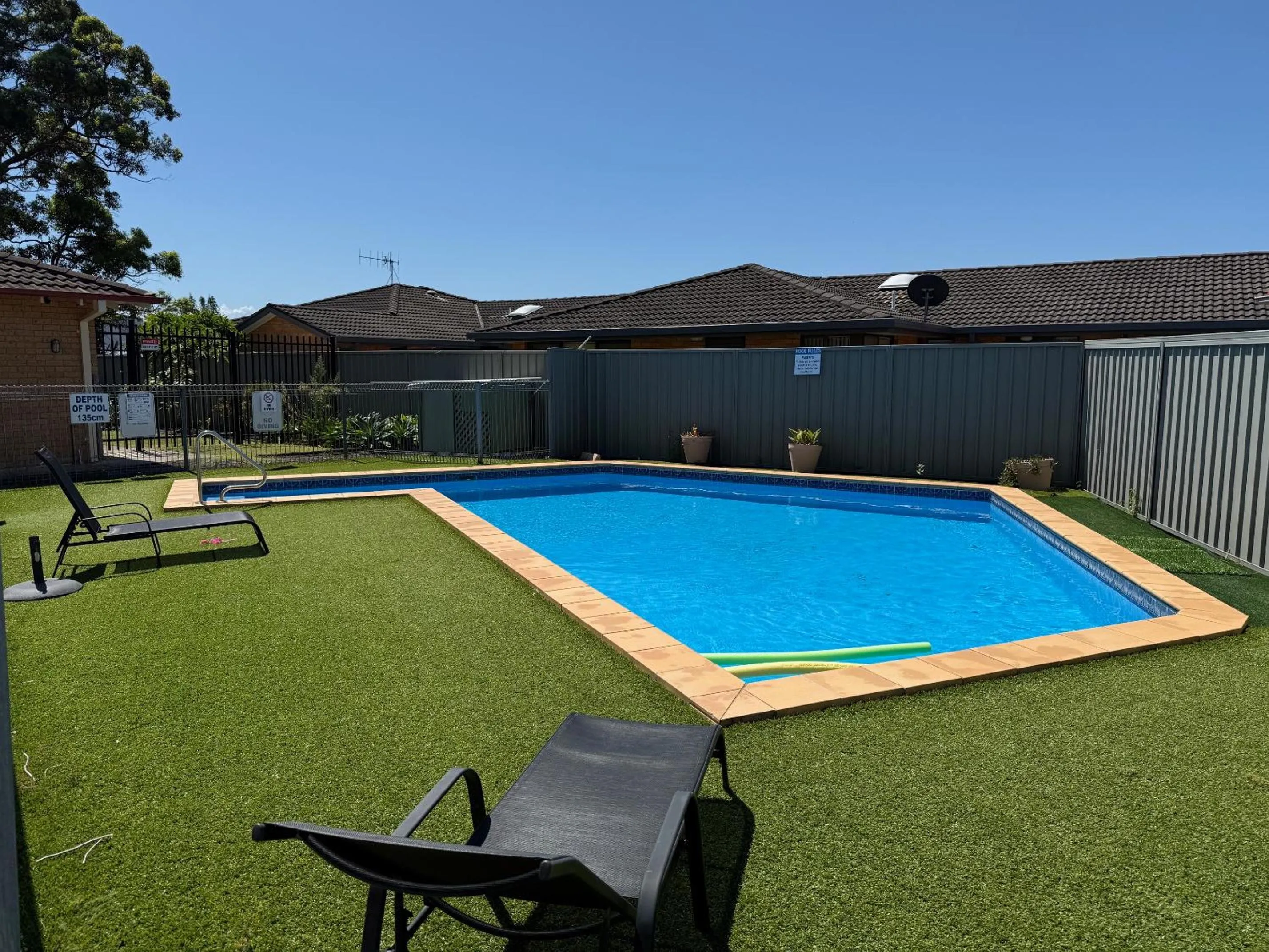 Swimming pool in Port O'Call Motel