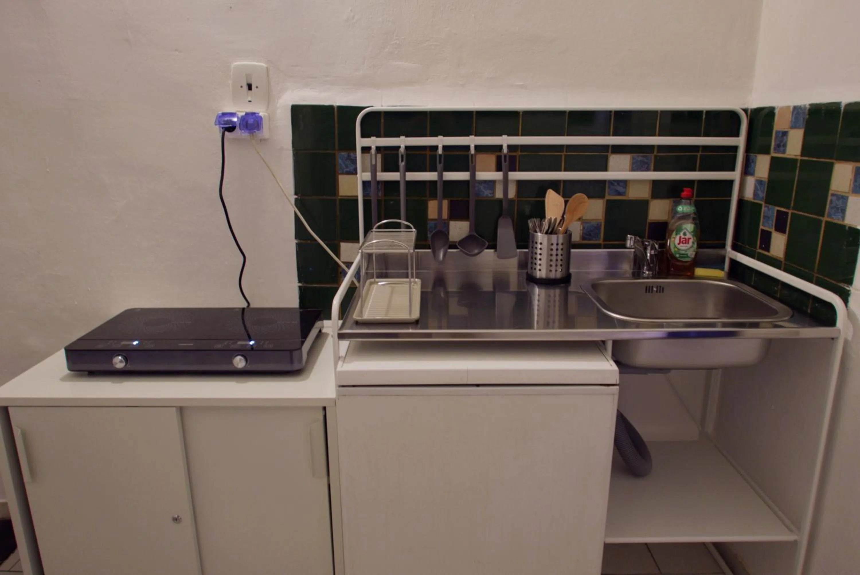 Communal kitchen in Clown and Bard Hostel