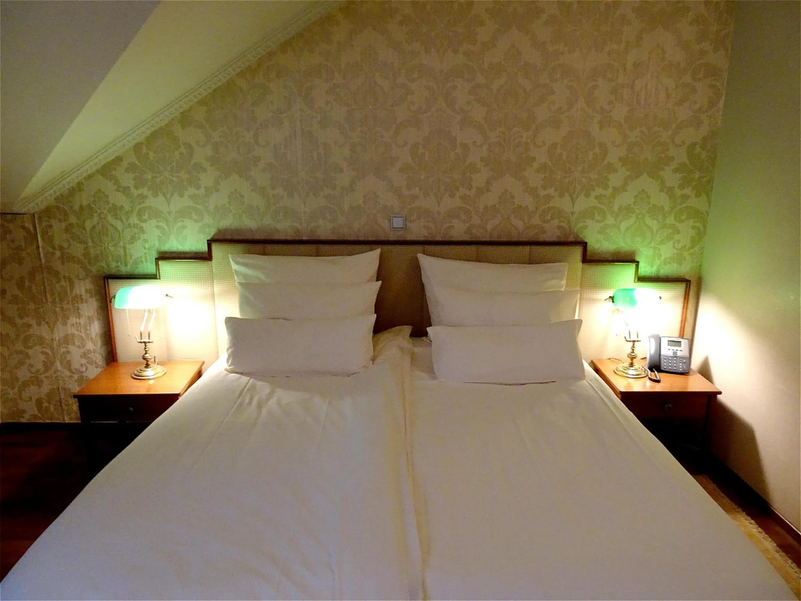 Bed in Hotel Mitra, Story Hotels