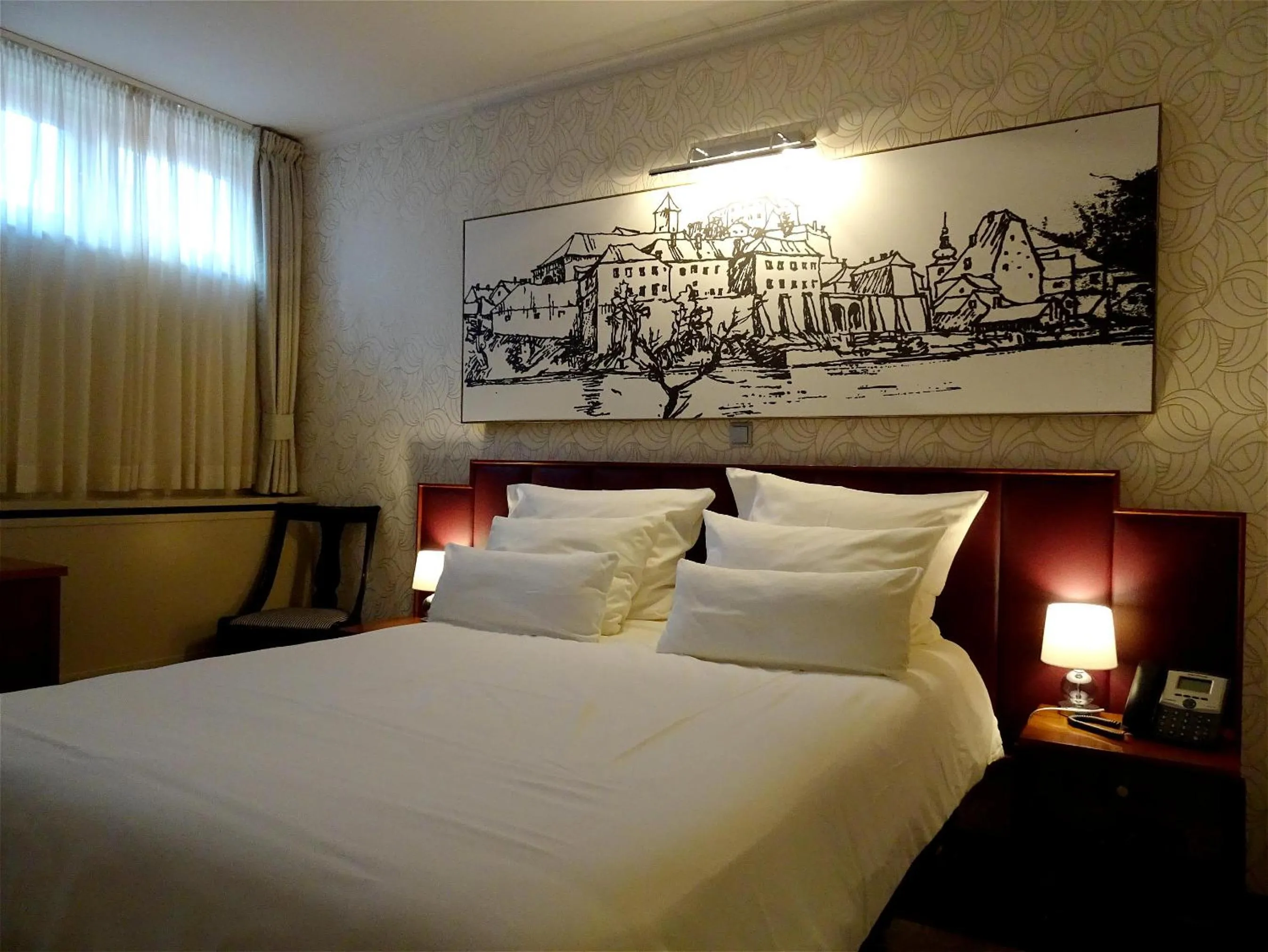 Bed in Hotel Mitra, Story Hotels
