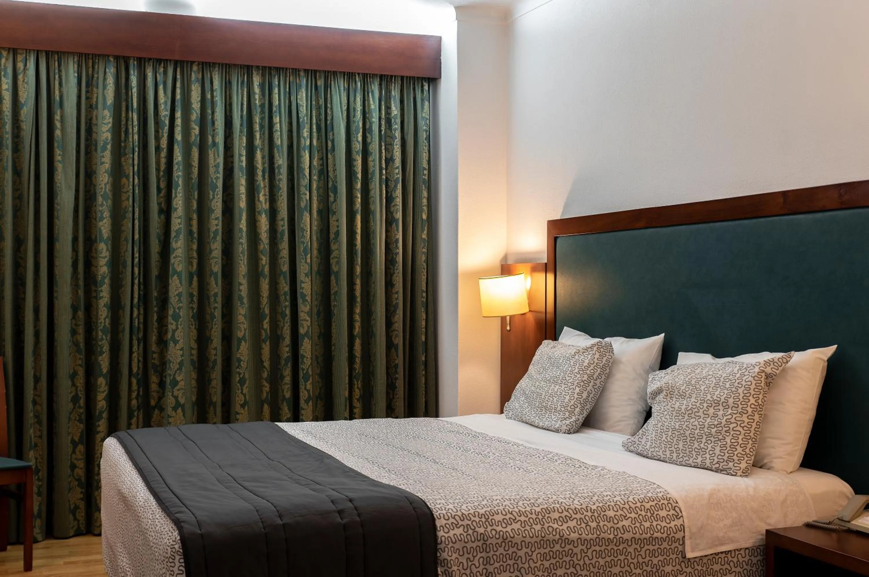 Bed in Hotel Samasa Fundao