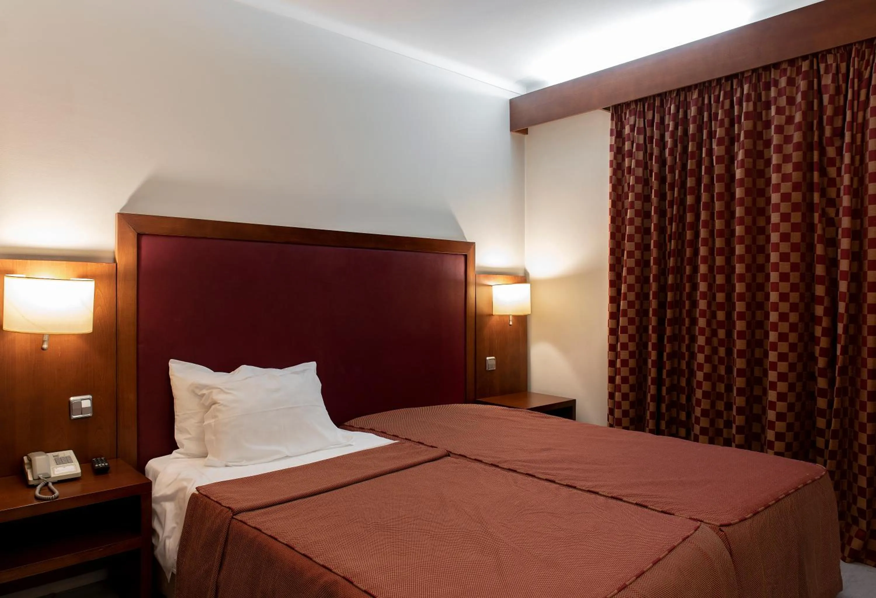 Bed in Hotel Samasa Fundao