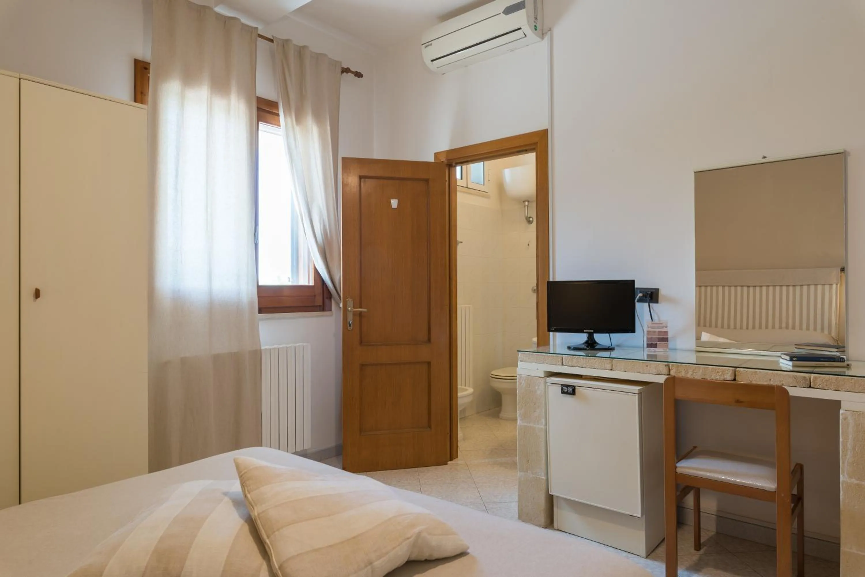 Bed in Piccolo Hotel Villa Rosa