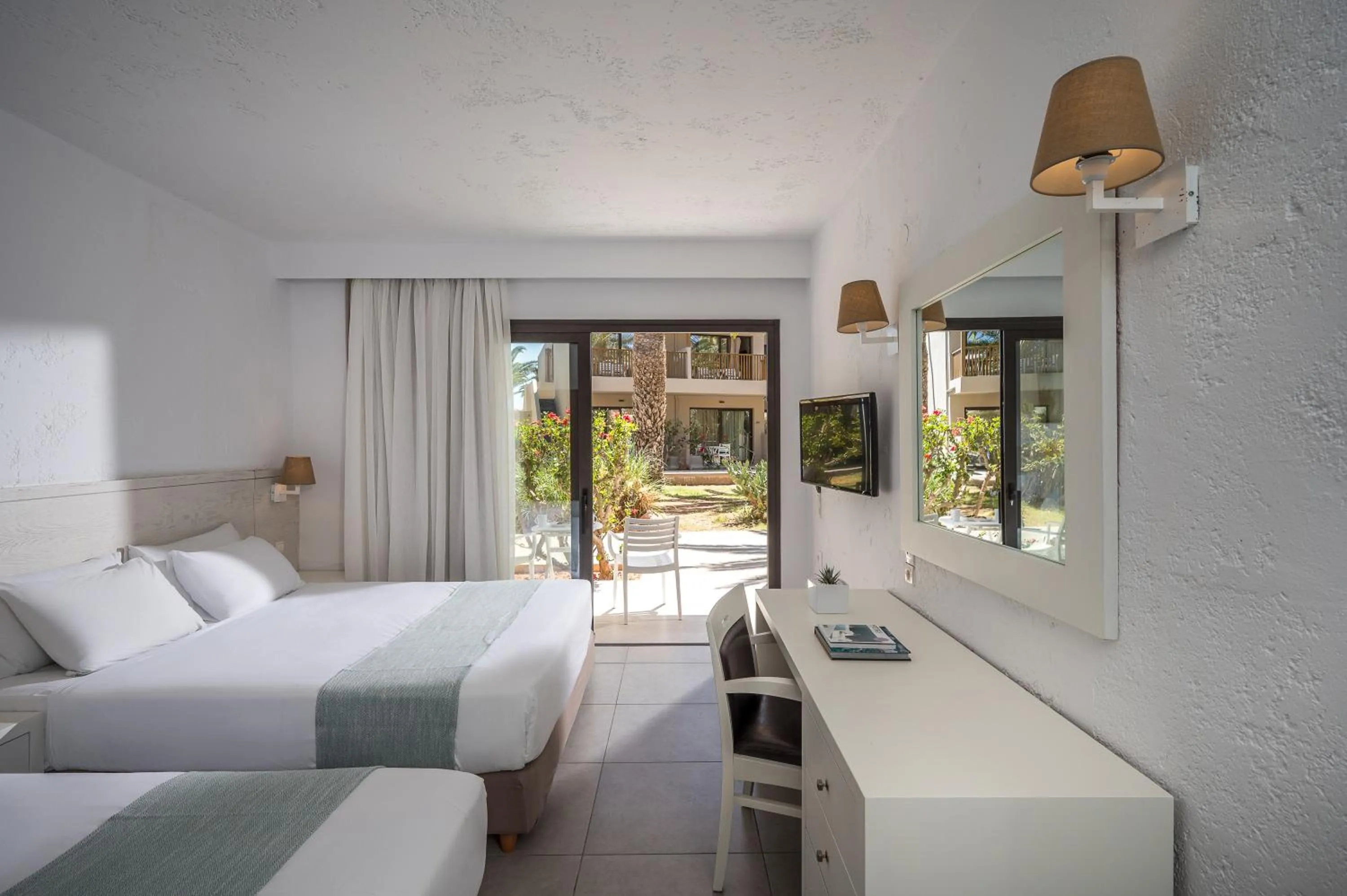 Bed in Stella Village Seaside Hotel