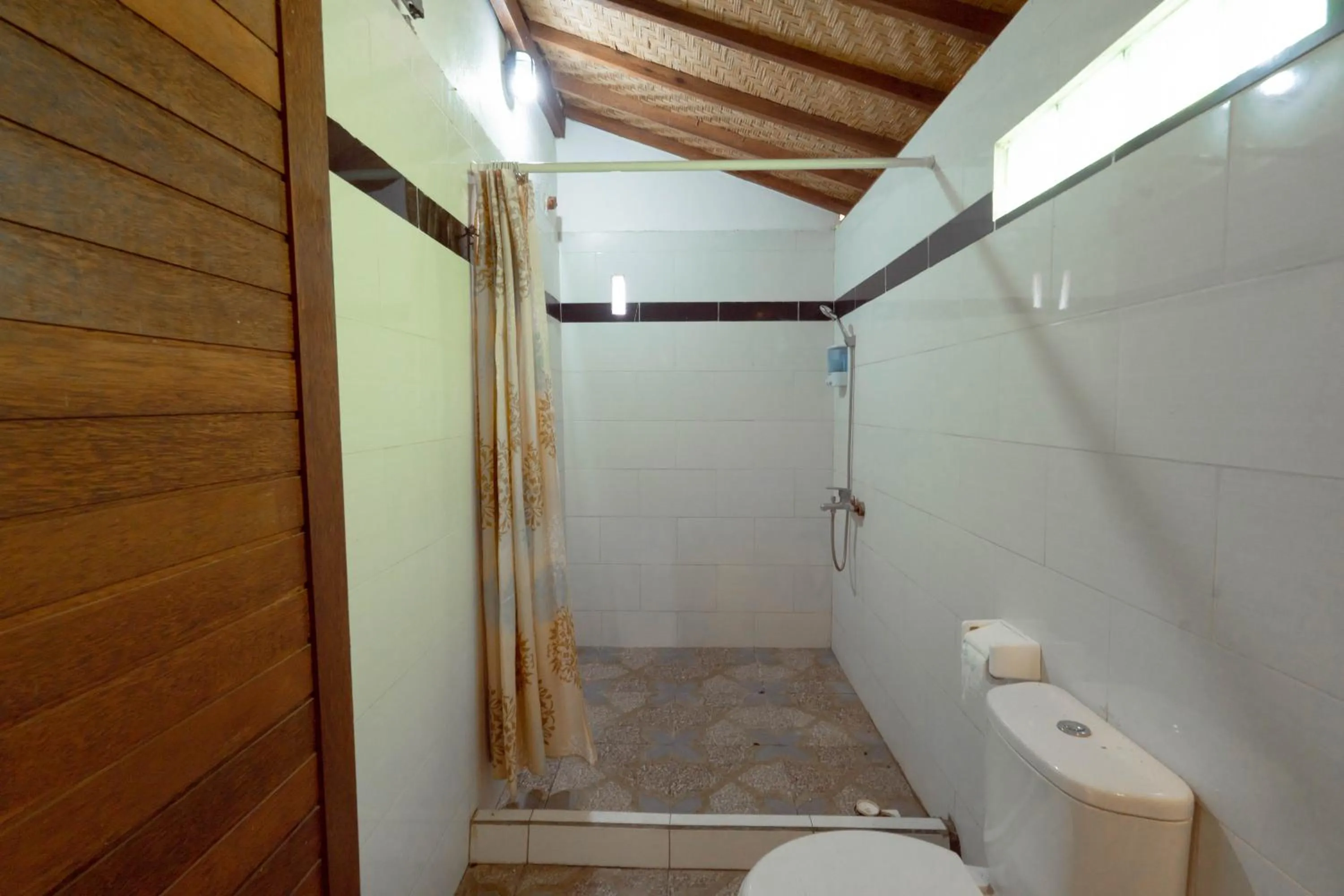 Bathroom in Ratu Cottage by OurStory Travels