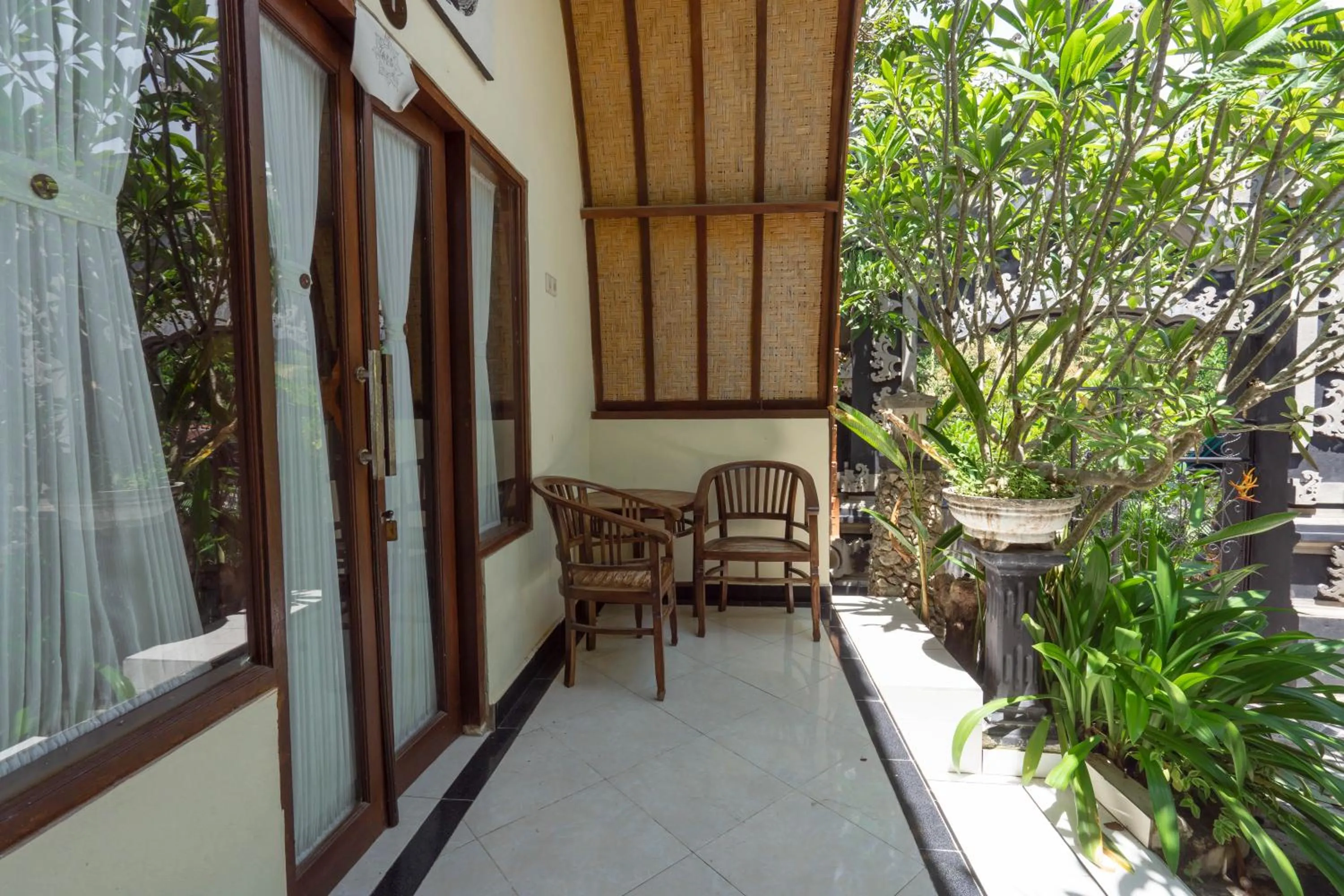Seating area in Ratu Cottage by OurStory Travels