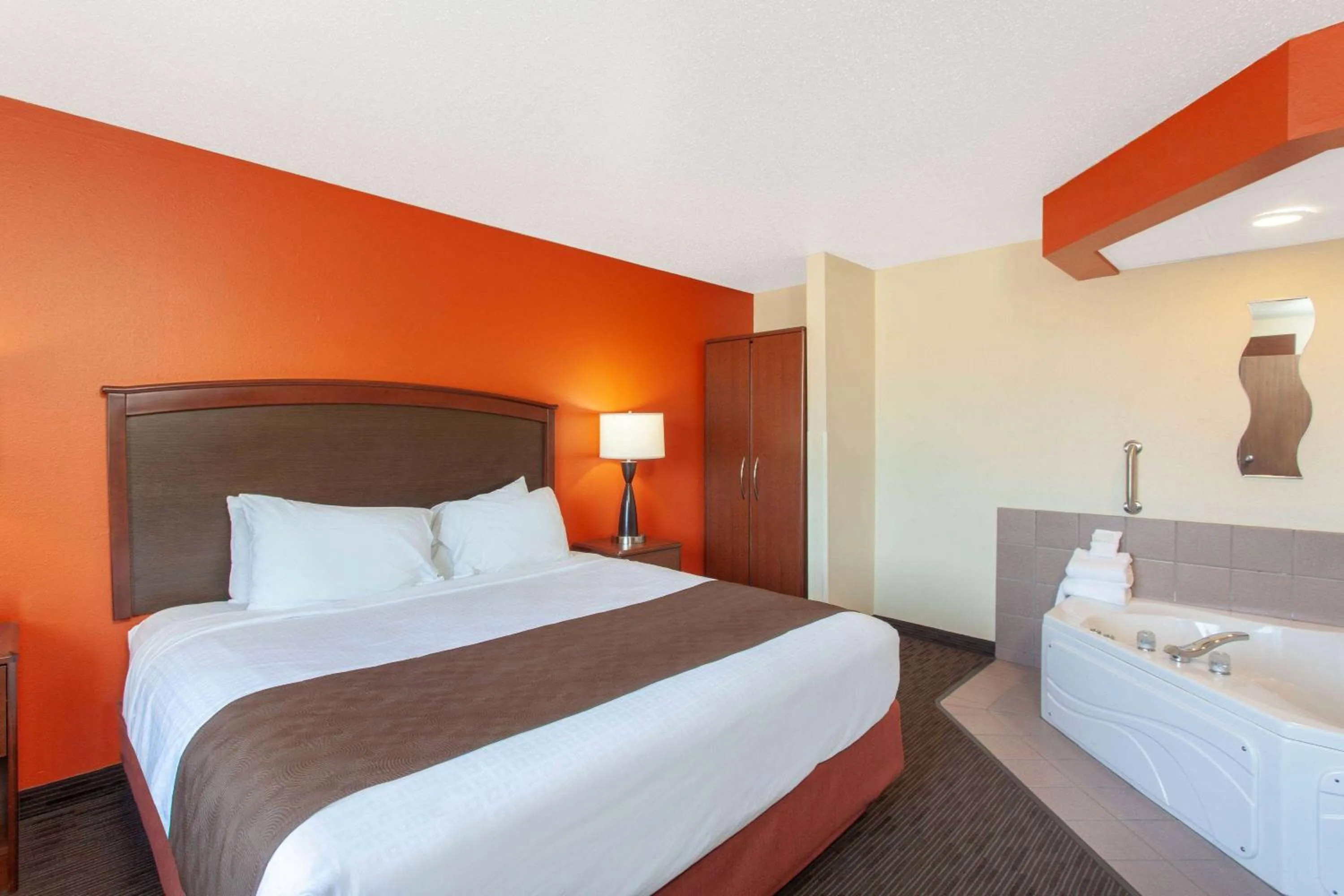 Photo of the whole room, Bed in AmericInn by Wyndham St Cloud MN I-94