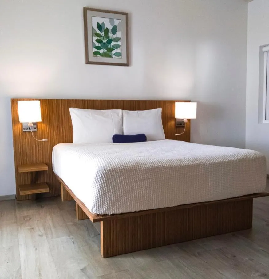 Bed in Trade Winds Hotel