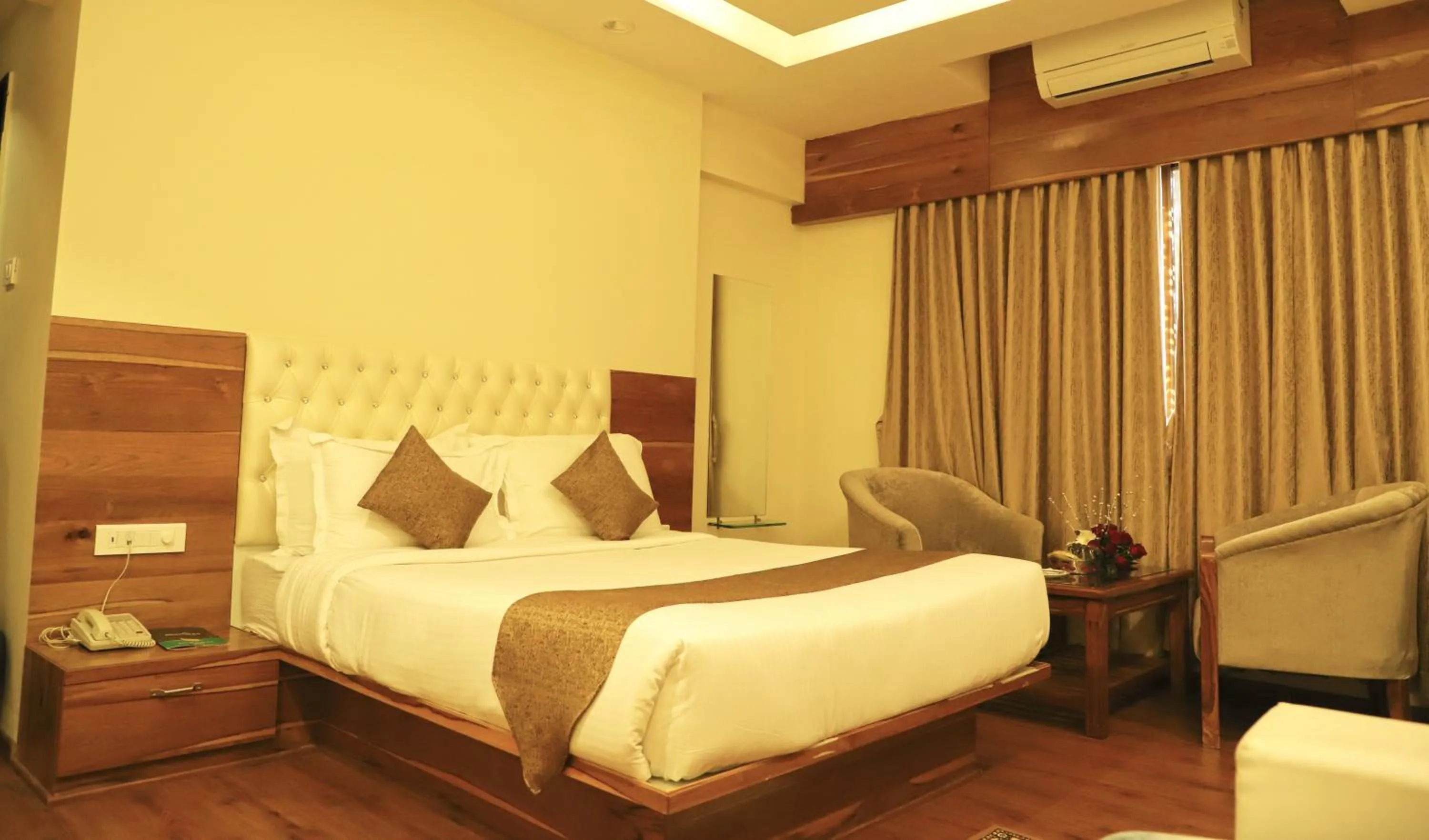 Seating area, Bed in Sai Neem Tree Hotel