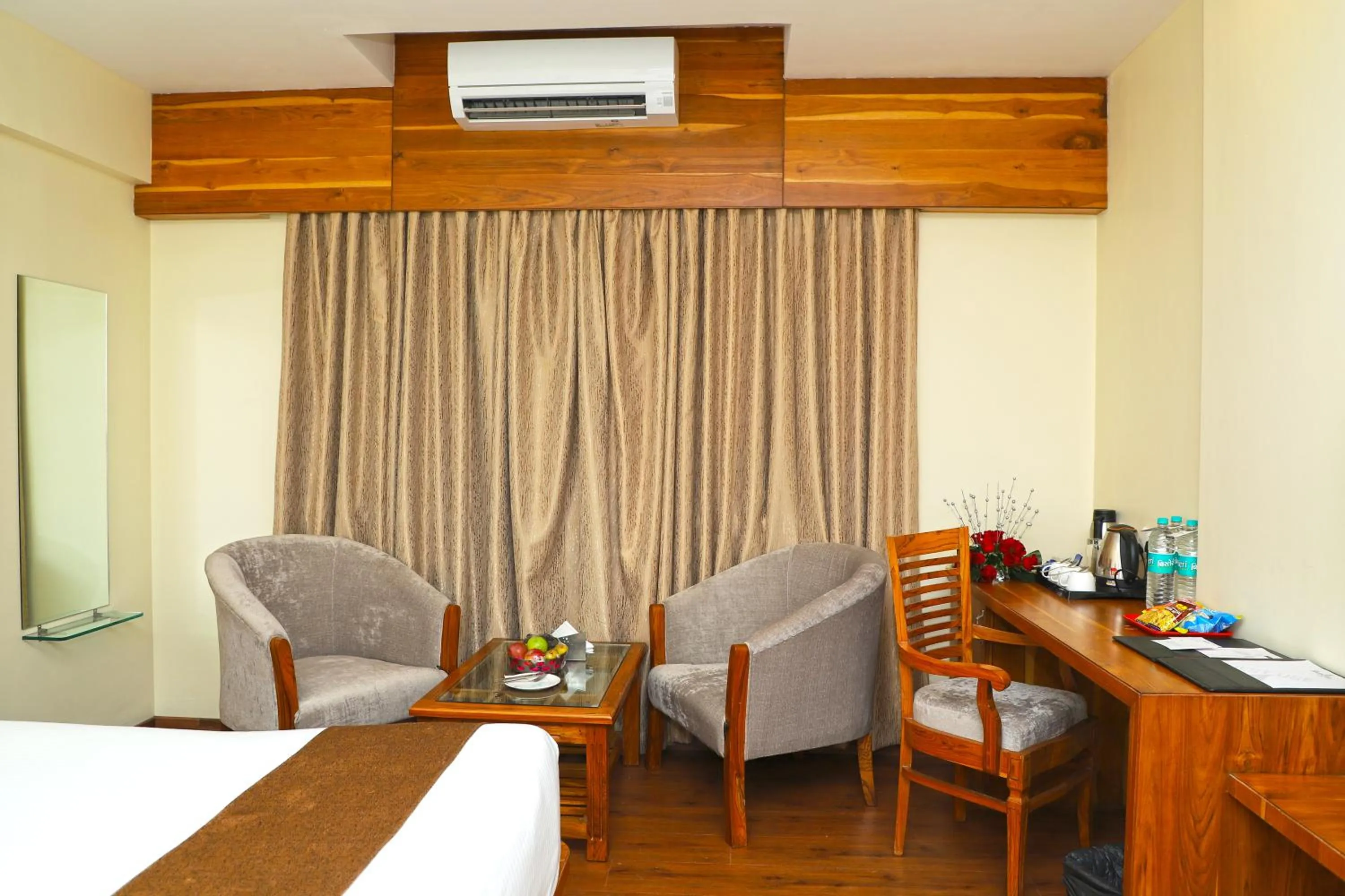 Seating area, Bed in Sai Neem Tree Hotel