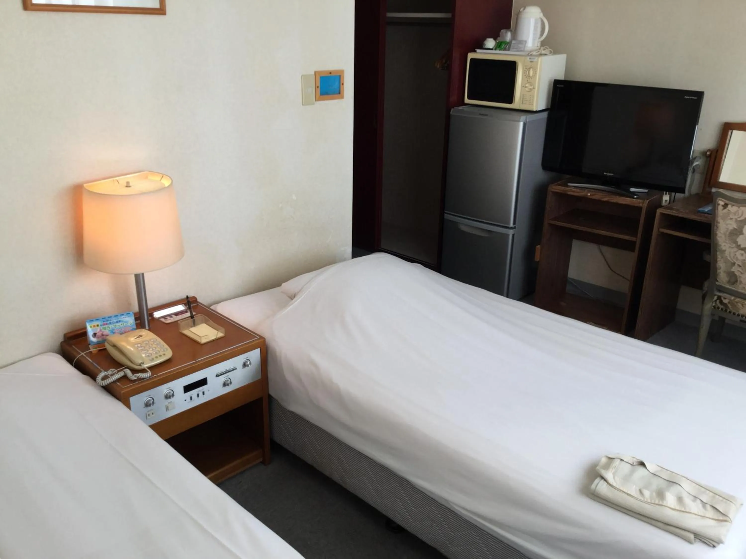 Bed in Hotel Peace Land Ishigaki