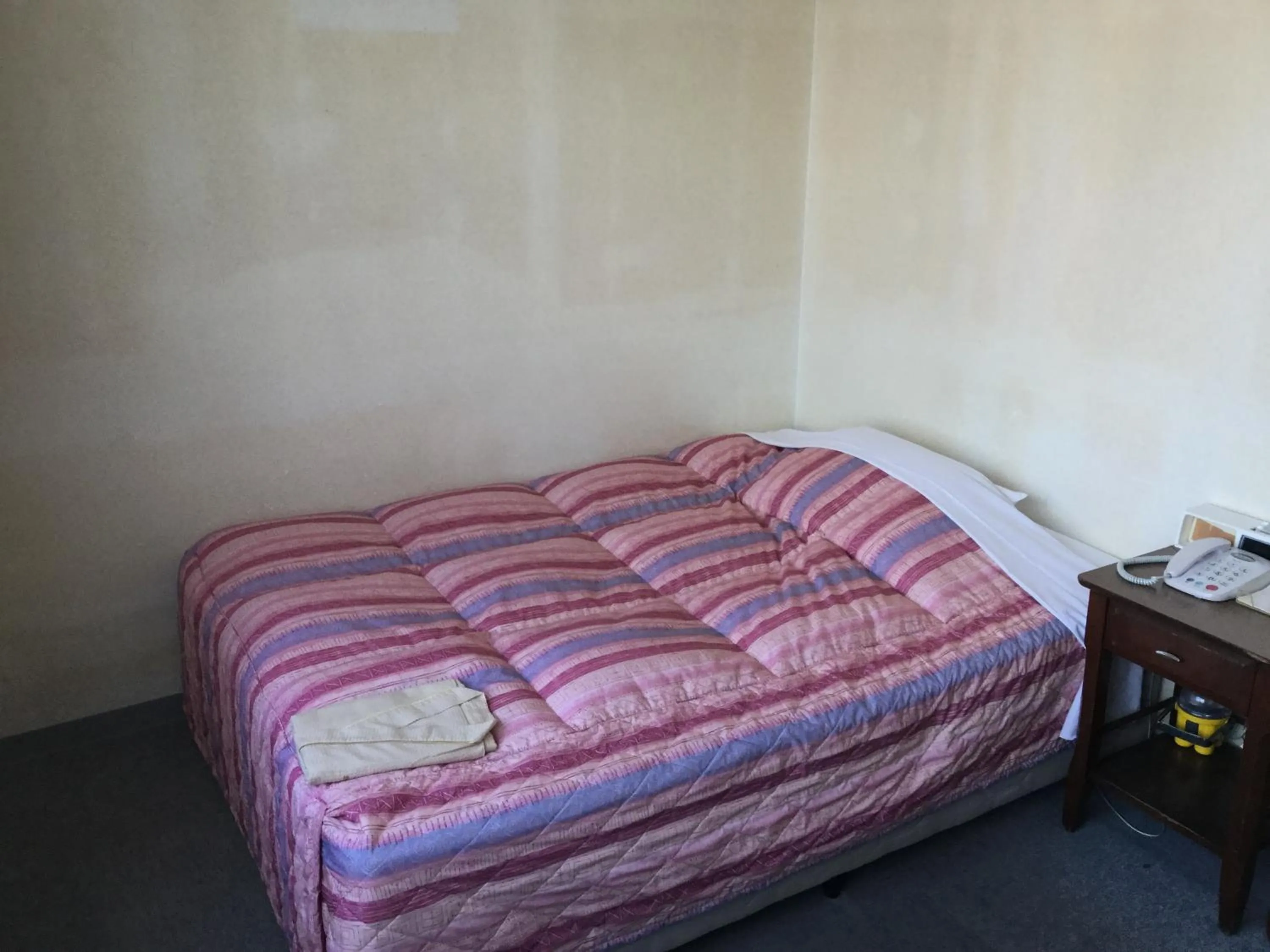 Bed in Hotel Peace Land Ishigaki