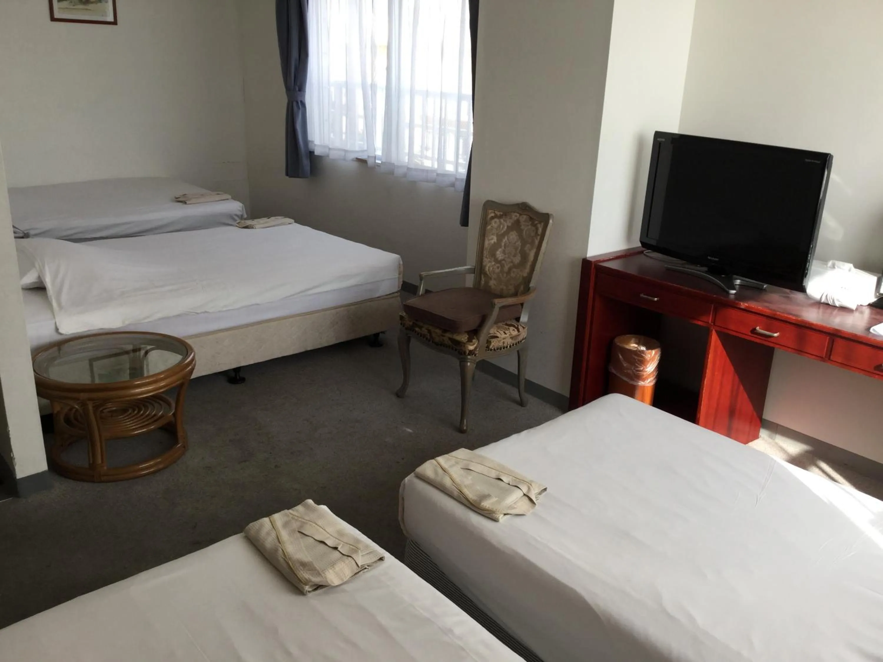 Bed in Hotel Peace Land Ishigaki