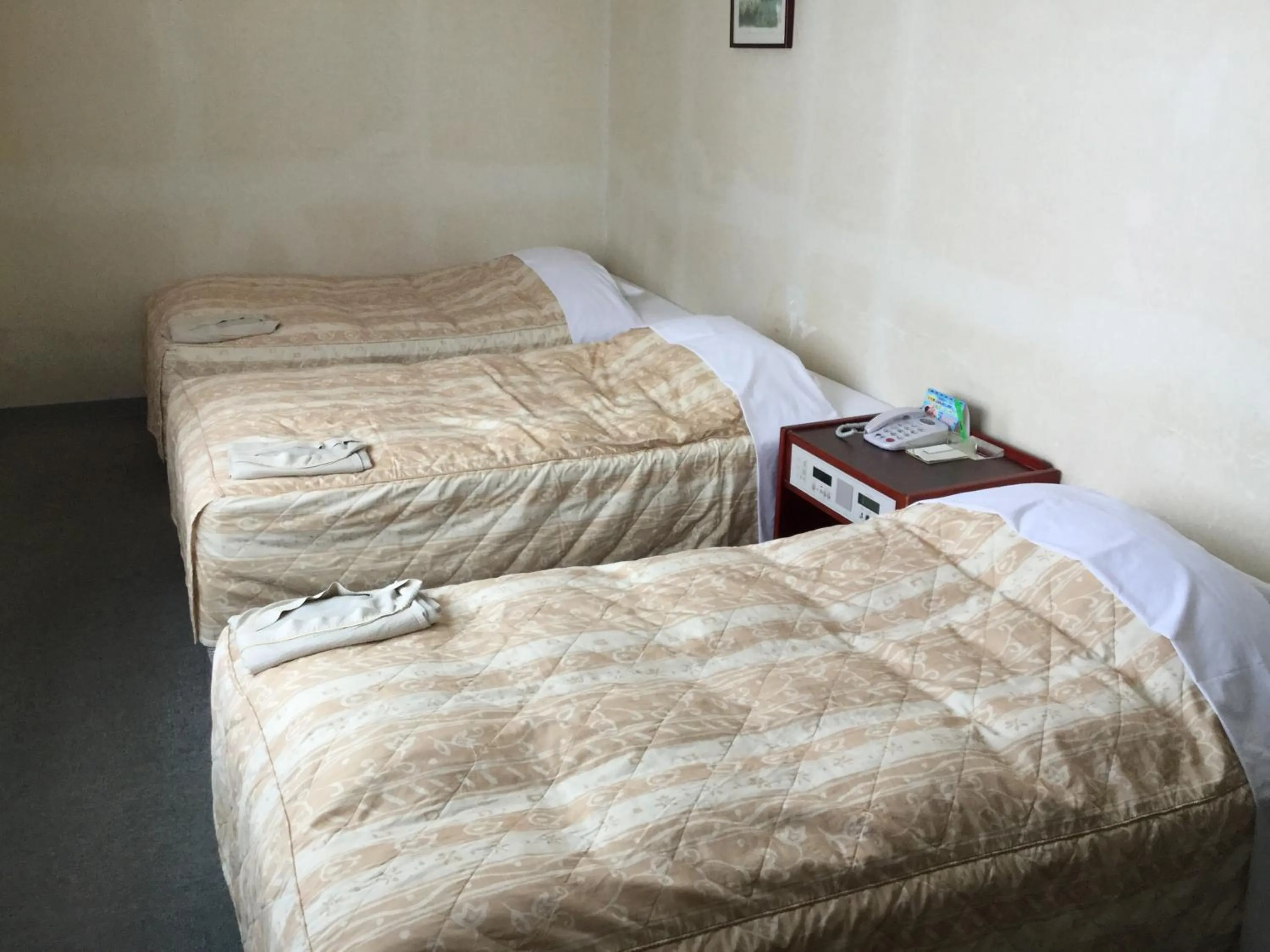 Bed in Hotel Peace Land Ishigaki