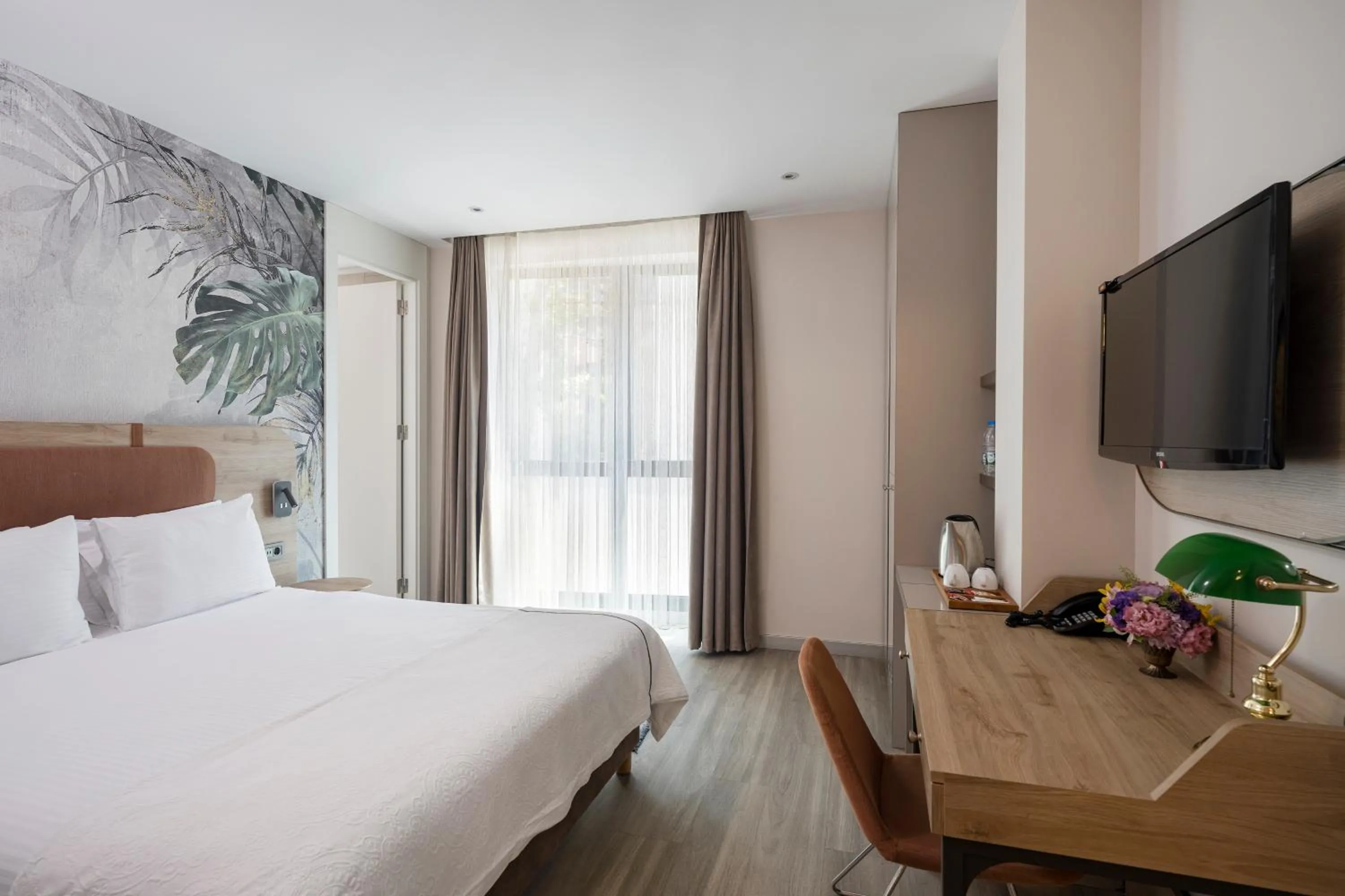 Bed in Upsuites Hotel