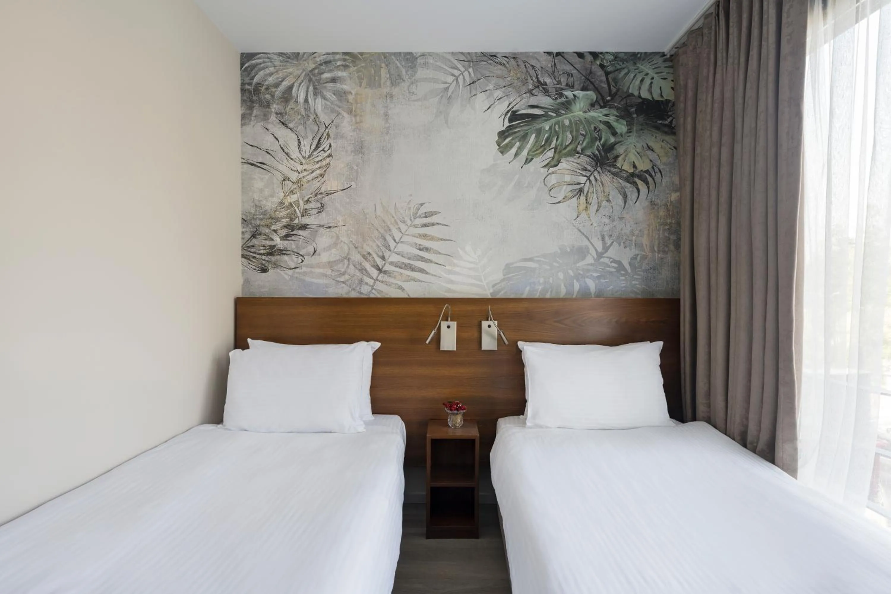 Bed in Upsuites Hotel