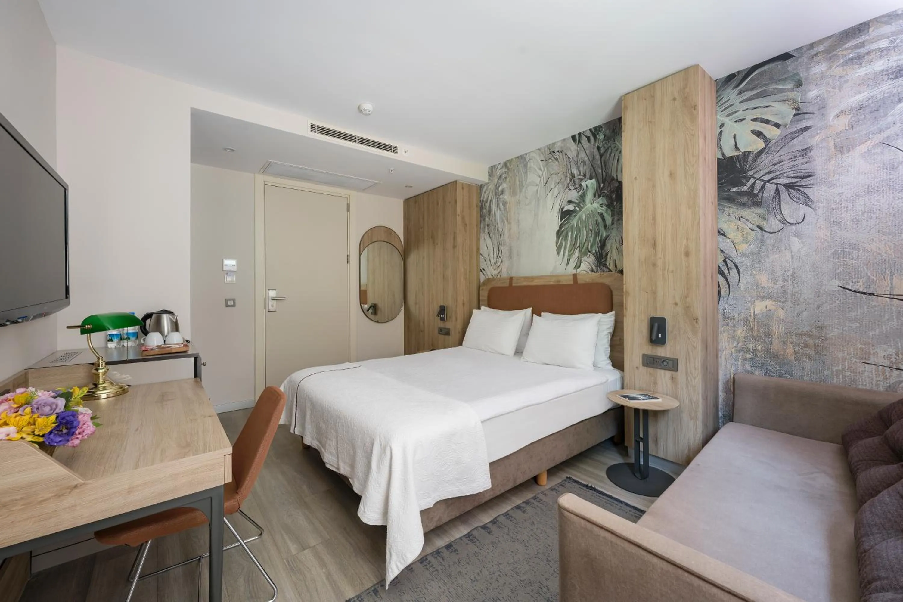 Bed in Upsuites Hotel