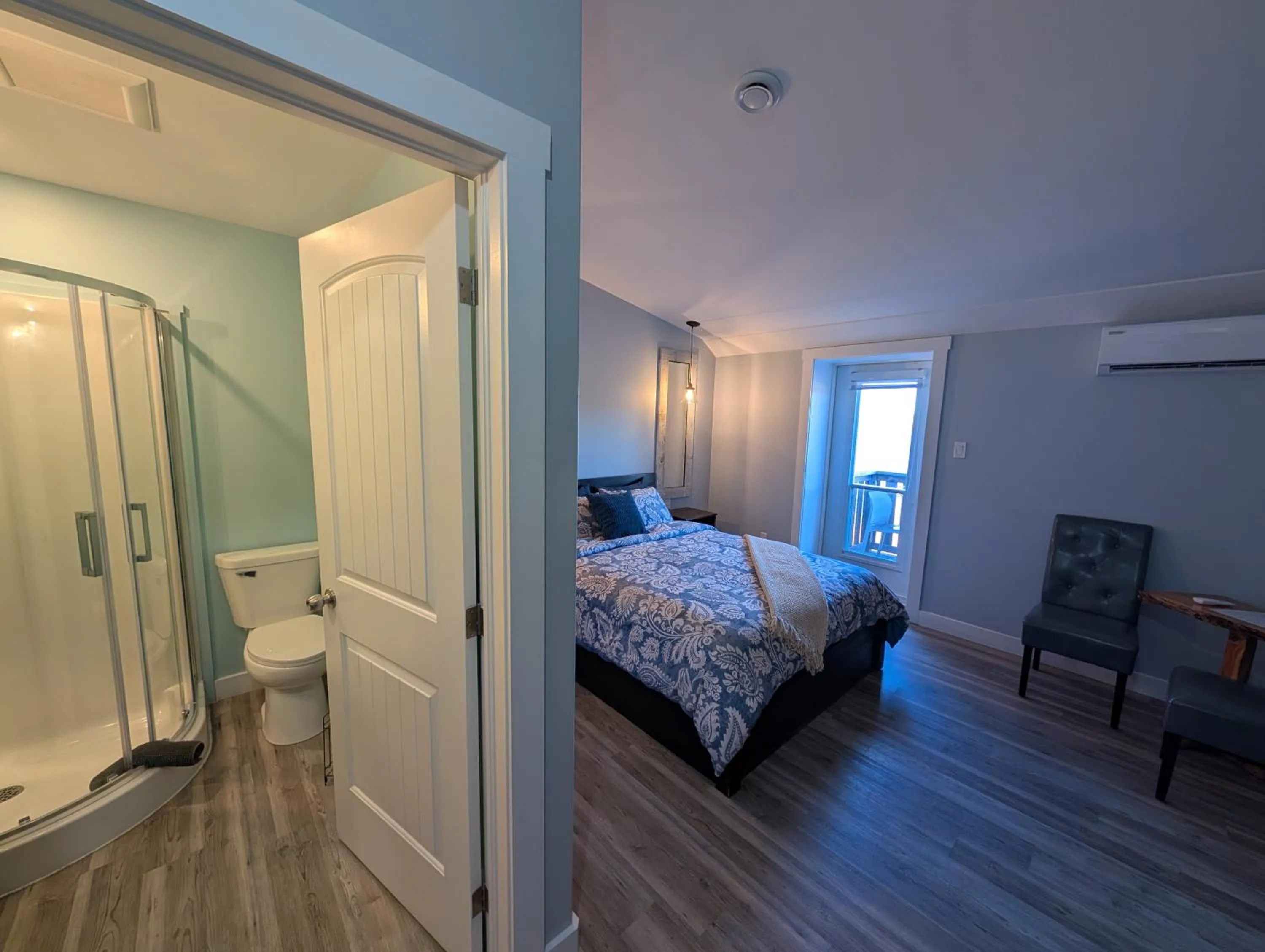 Bed in Dildo Boathouse Inn