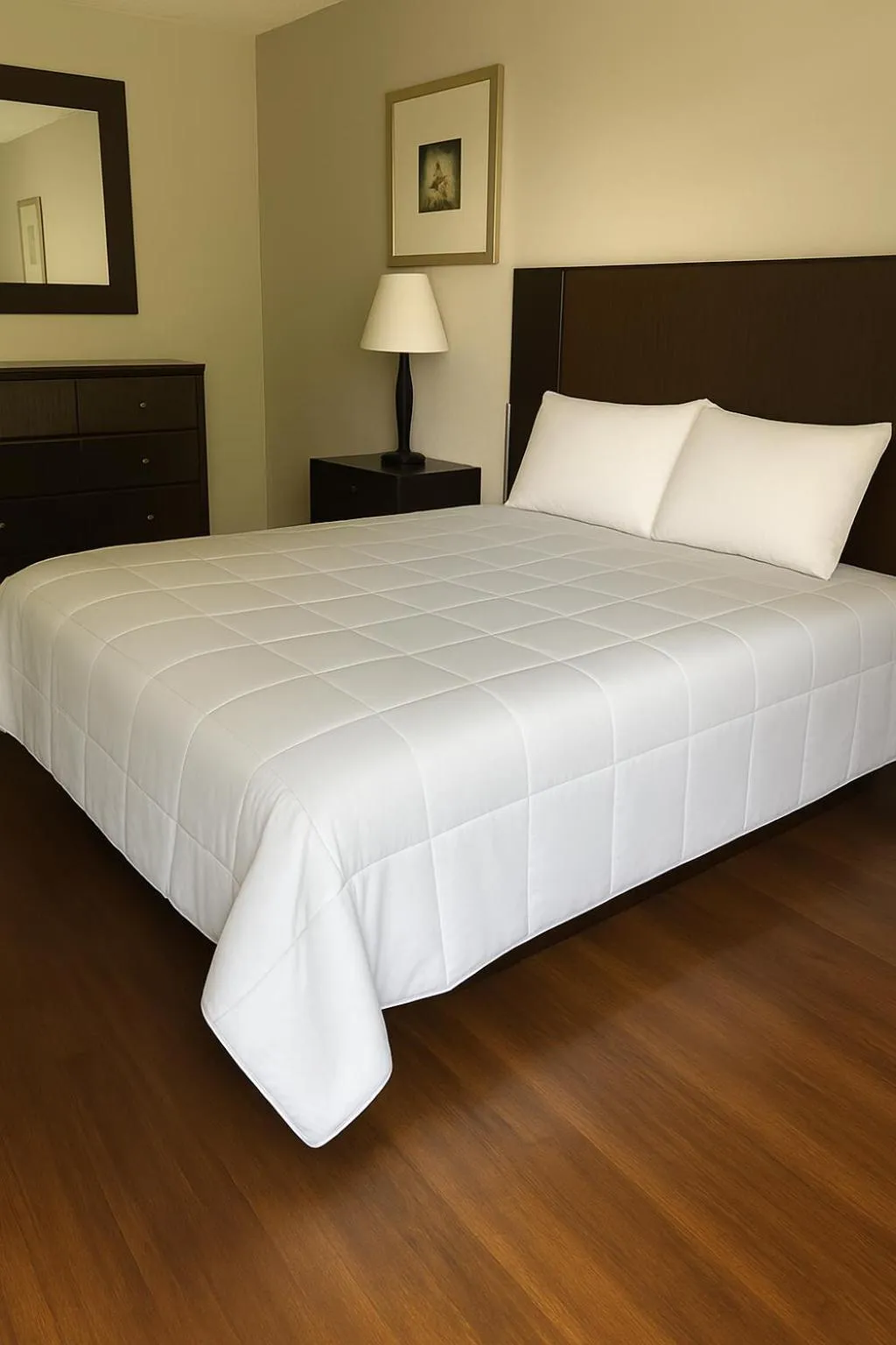 Bed in APM Inn and Suites