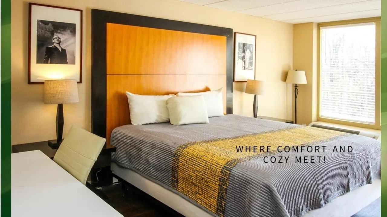 Bed in APM Inn and Suites