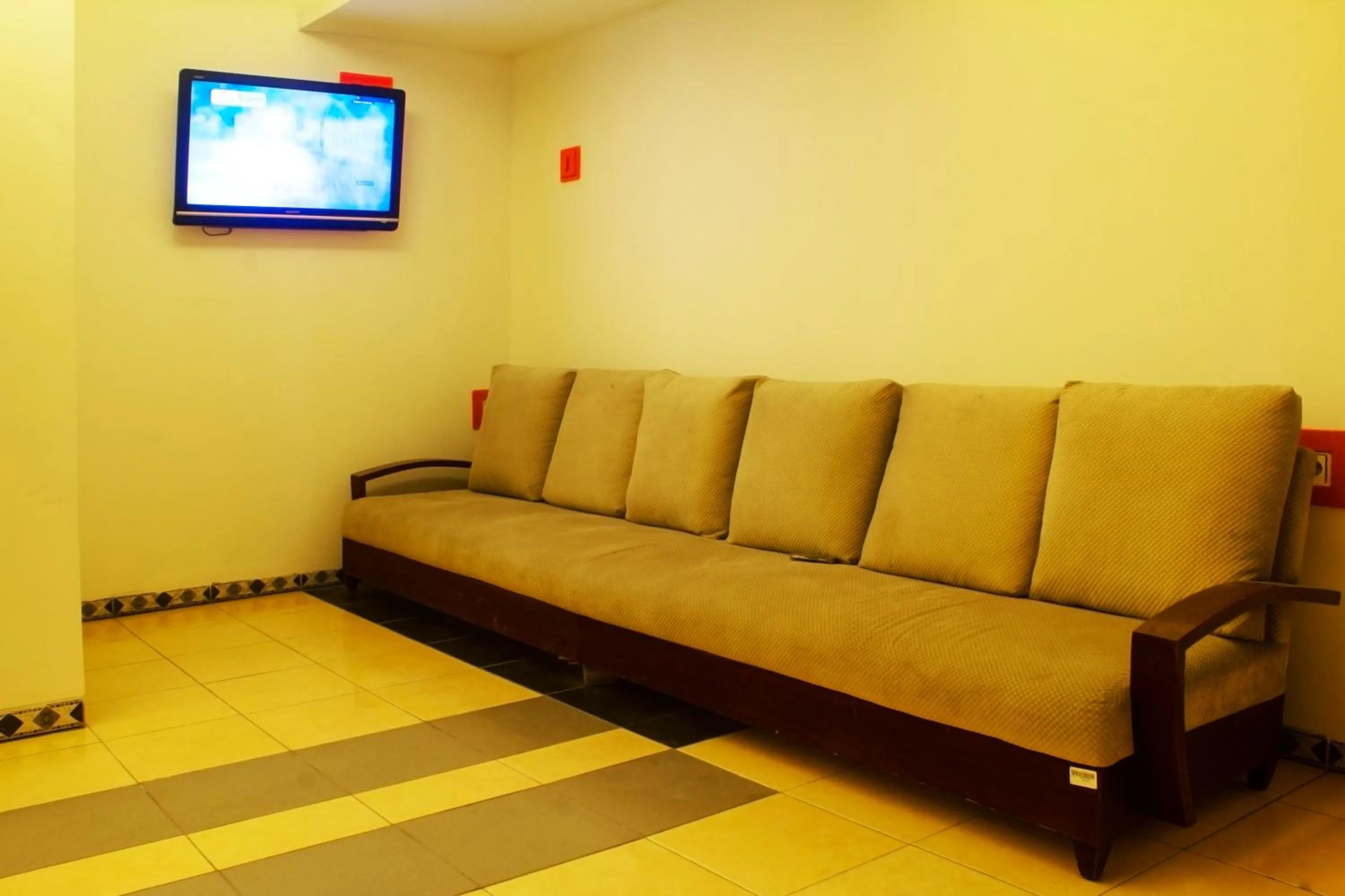 Seating area in New Priok Indah Syariah Hotel