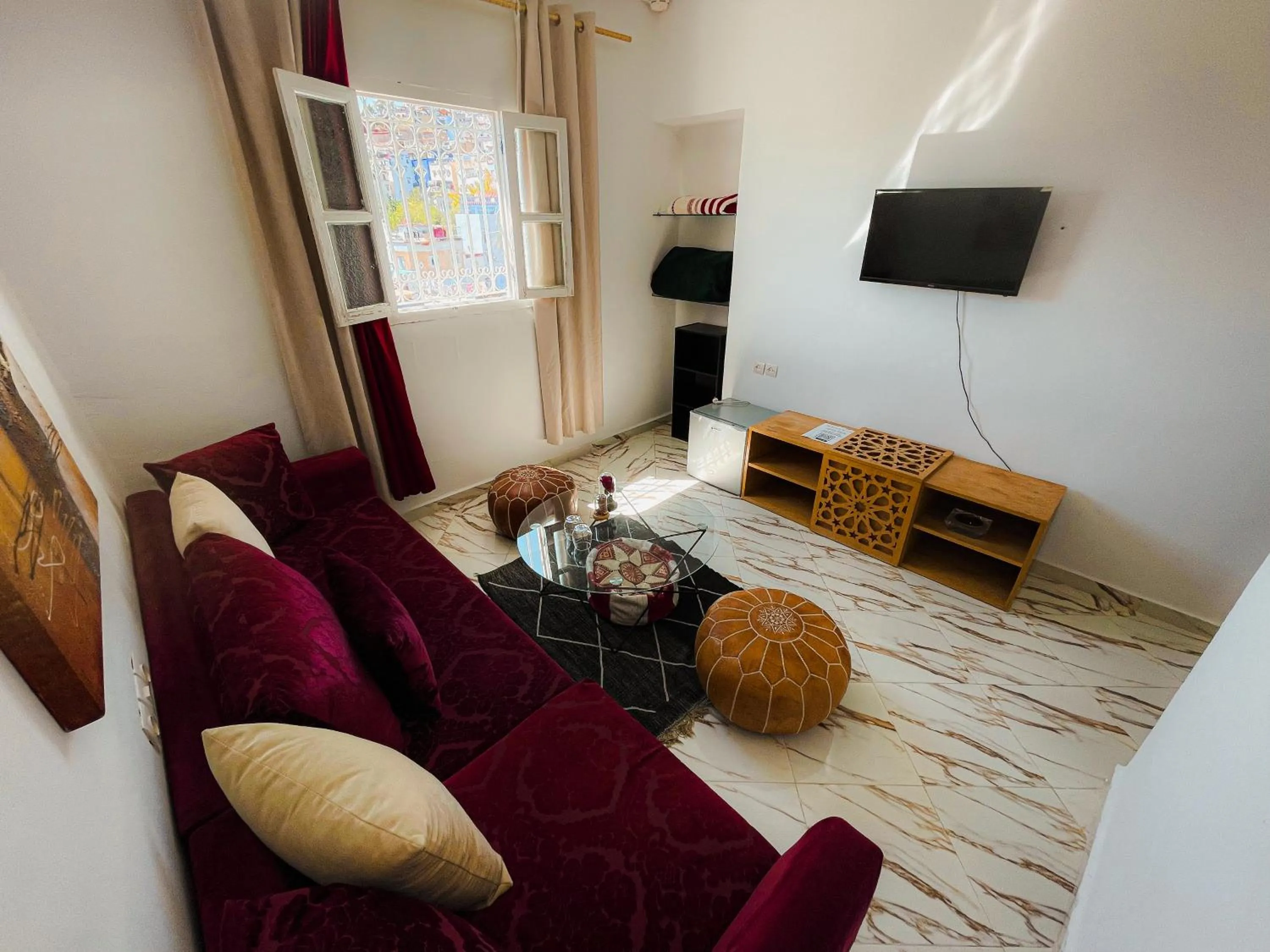 Communal lounge/ TV room in Hotel Princesse Ilham