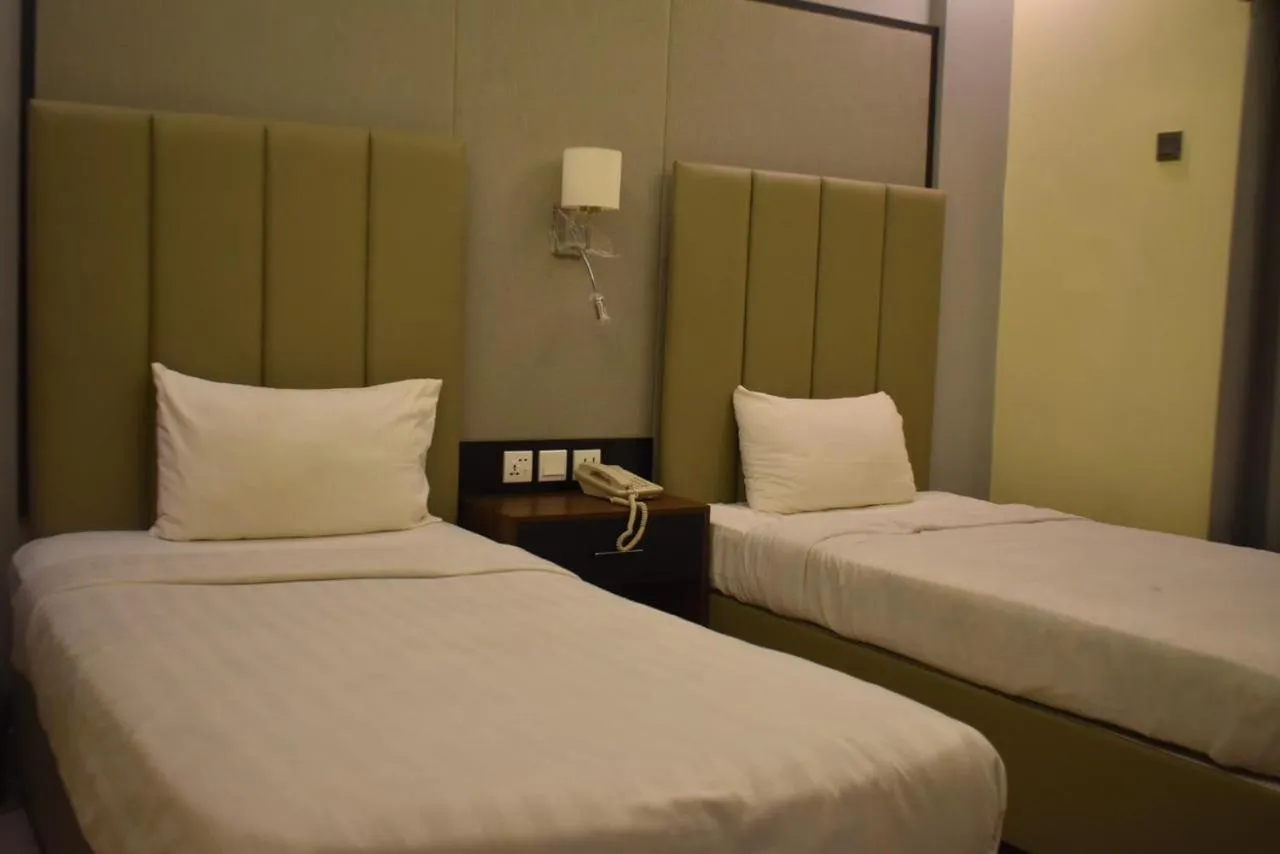 Bed in Sunset Suites